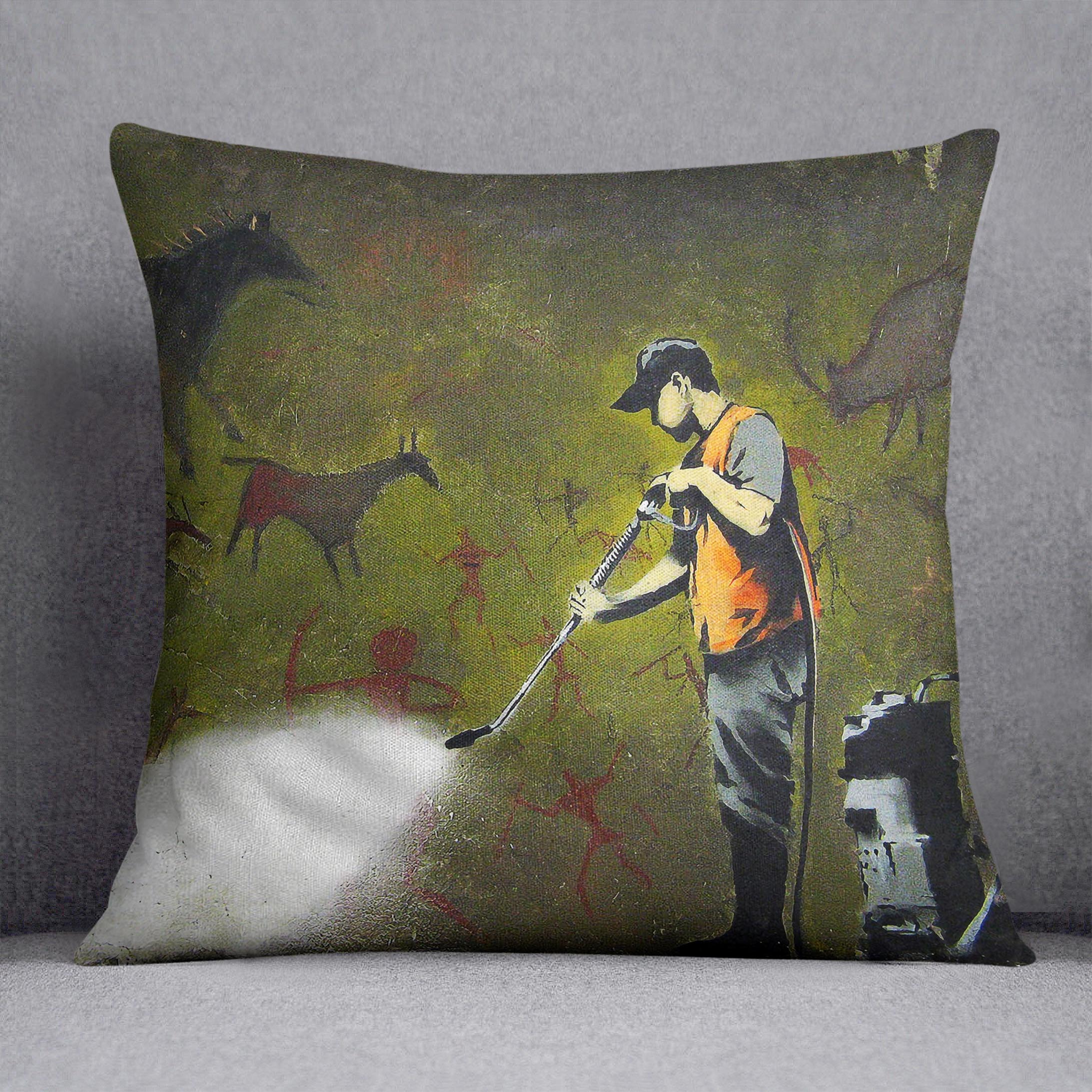 Banksy Cave Graffiti Removal Cushion featuring vibrant abstract designs on luxurious vegan faux suede.