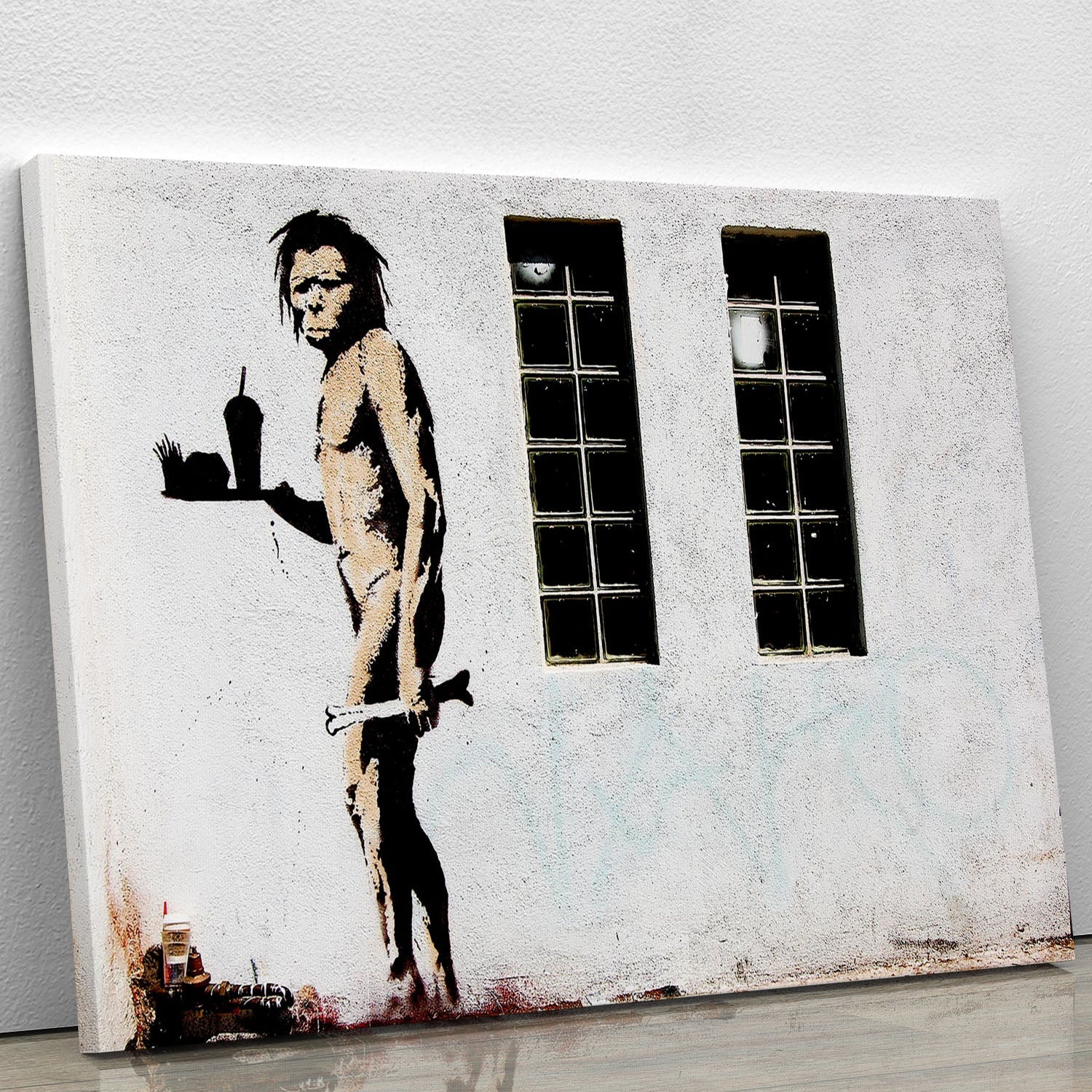 Banksy Caveman Takeaway canvas print showcasing modern street art with a humorous twist on consumerism.