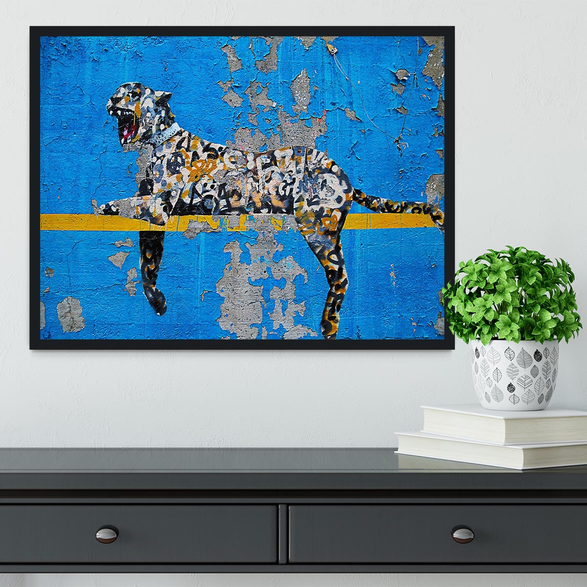 Banksy Cheetah Framed Print showcasing vibrant colors in a handmade frame, available in black, white, or natural wood.