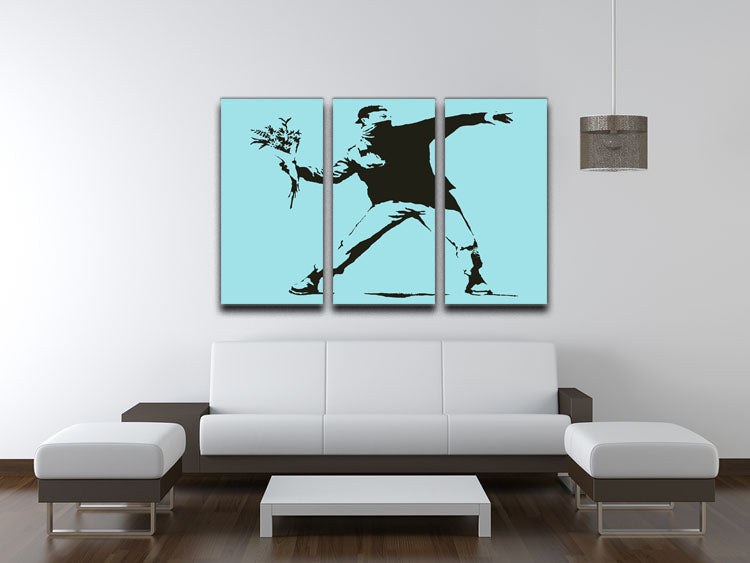 Banksy Flower Thrower Light Blue 3 Split Panel Canvas Print showcasing vibrant colors and modern art design.