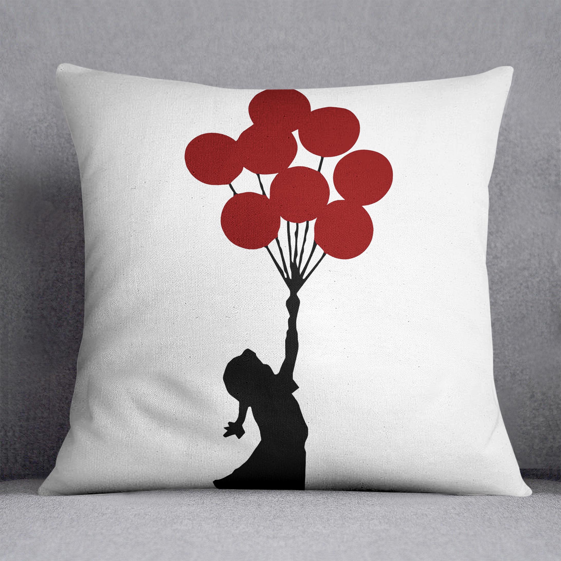 Banksy Flying Balloon Girl Cushion featuring vibrant colors and luxurious vegan faux suede fabric, perfect for home decor.
