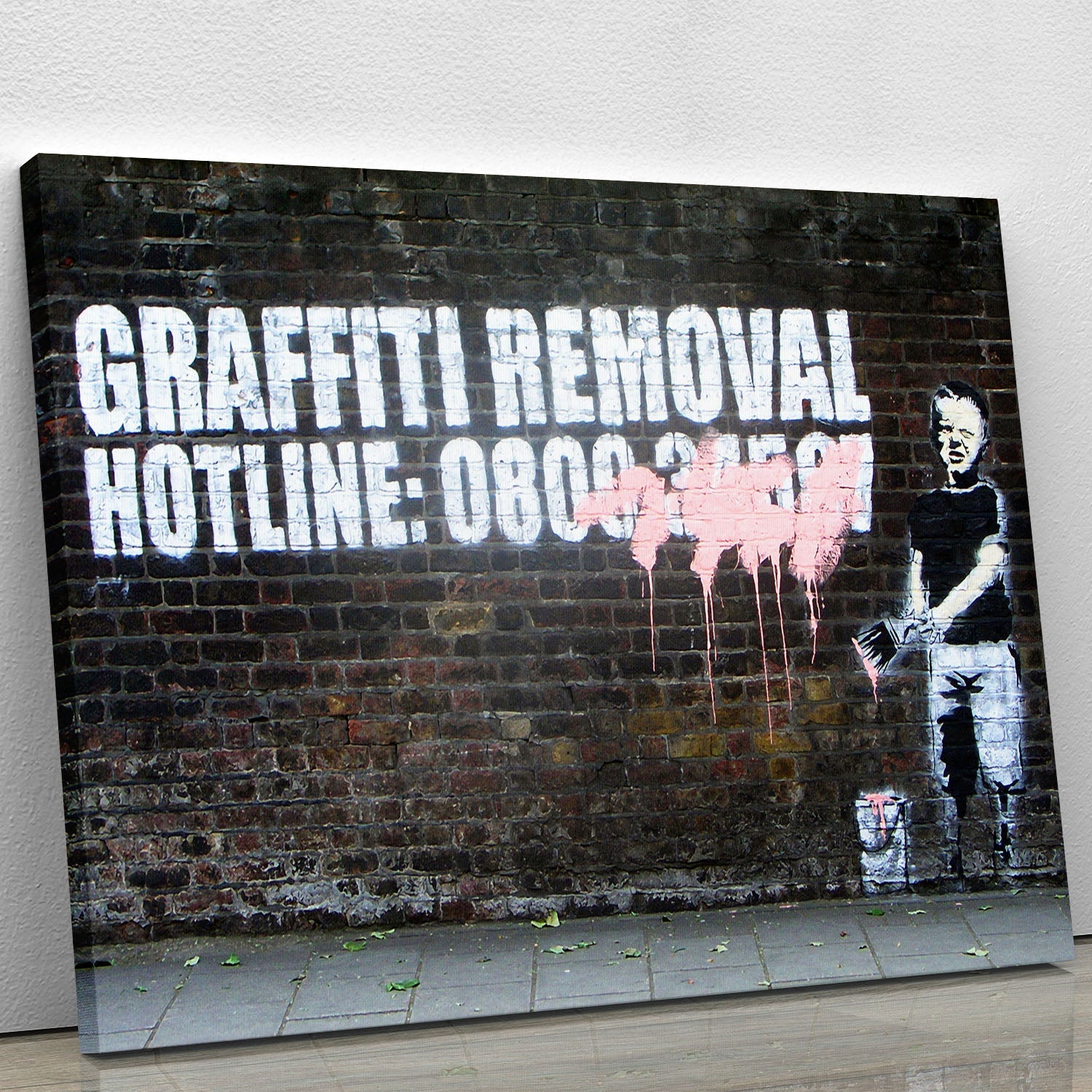 Banksy Graffiti Removal Hotline canvas print featuring urban art style with bold colors and social commentary.