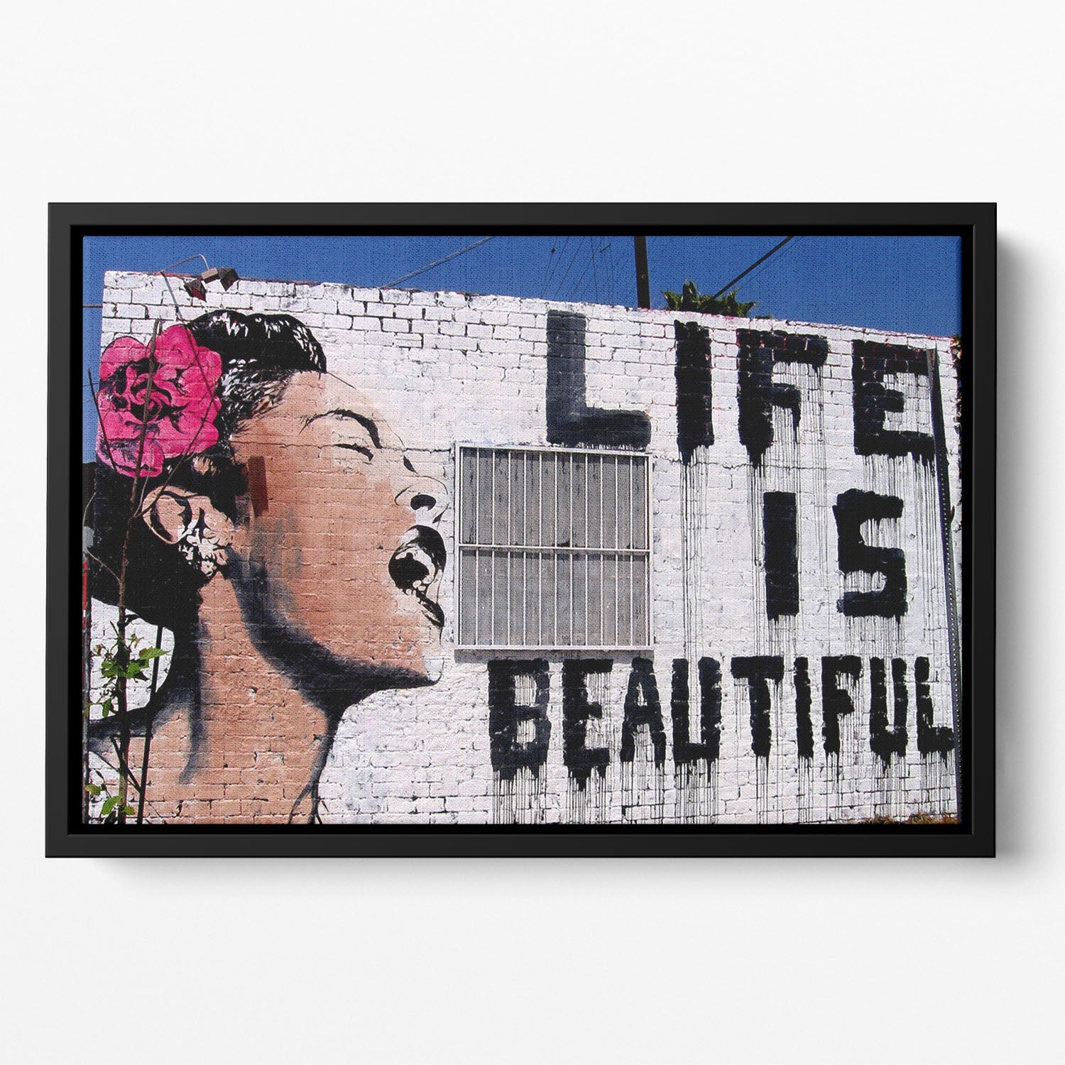 Banksy Life is Beautiful Floating Framed Canvas featuring vibrant colors and abstract design in an elegant wooden frame.