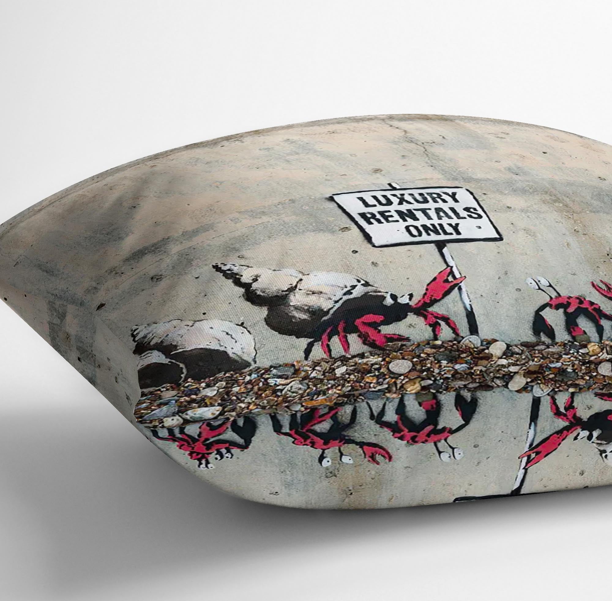 Banksy Luxury Rentals Only Cushion featuring vibrant abstract designs on luxurious vegan faux suede, showcasing its plush filling and handmade quality.