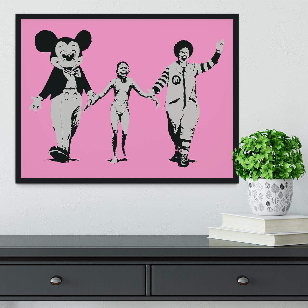 Banksy Mickey and Ronald Pink Framed Print featuring vibrant colors and a stylish handmade frame.