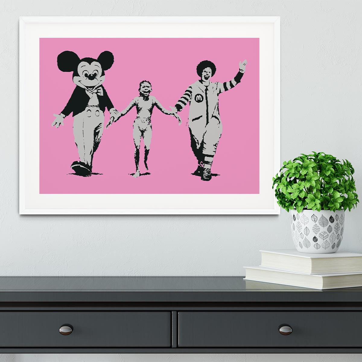 Banksy Mickey and Ronald Pink Framed Print featuring vibrant colors and a stylish handmade frame.