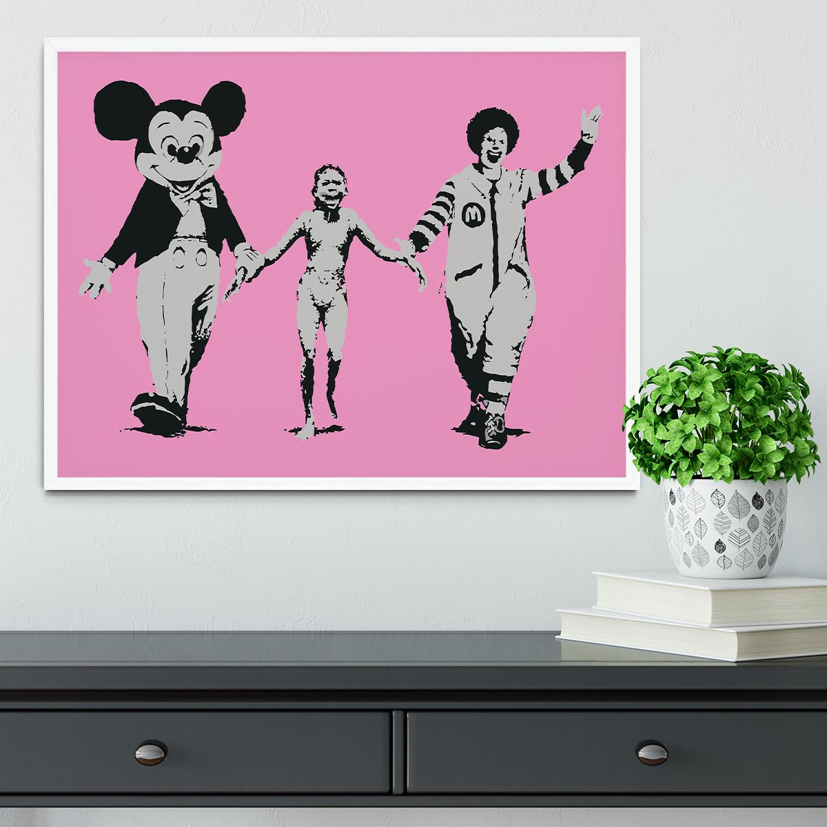 Banksy Mickey and Ronald Pink Framed Print featuring vibrant colors and a stylish handmade frame.
