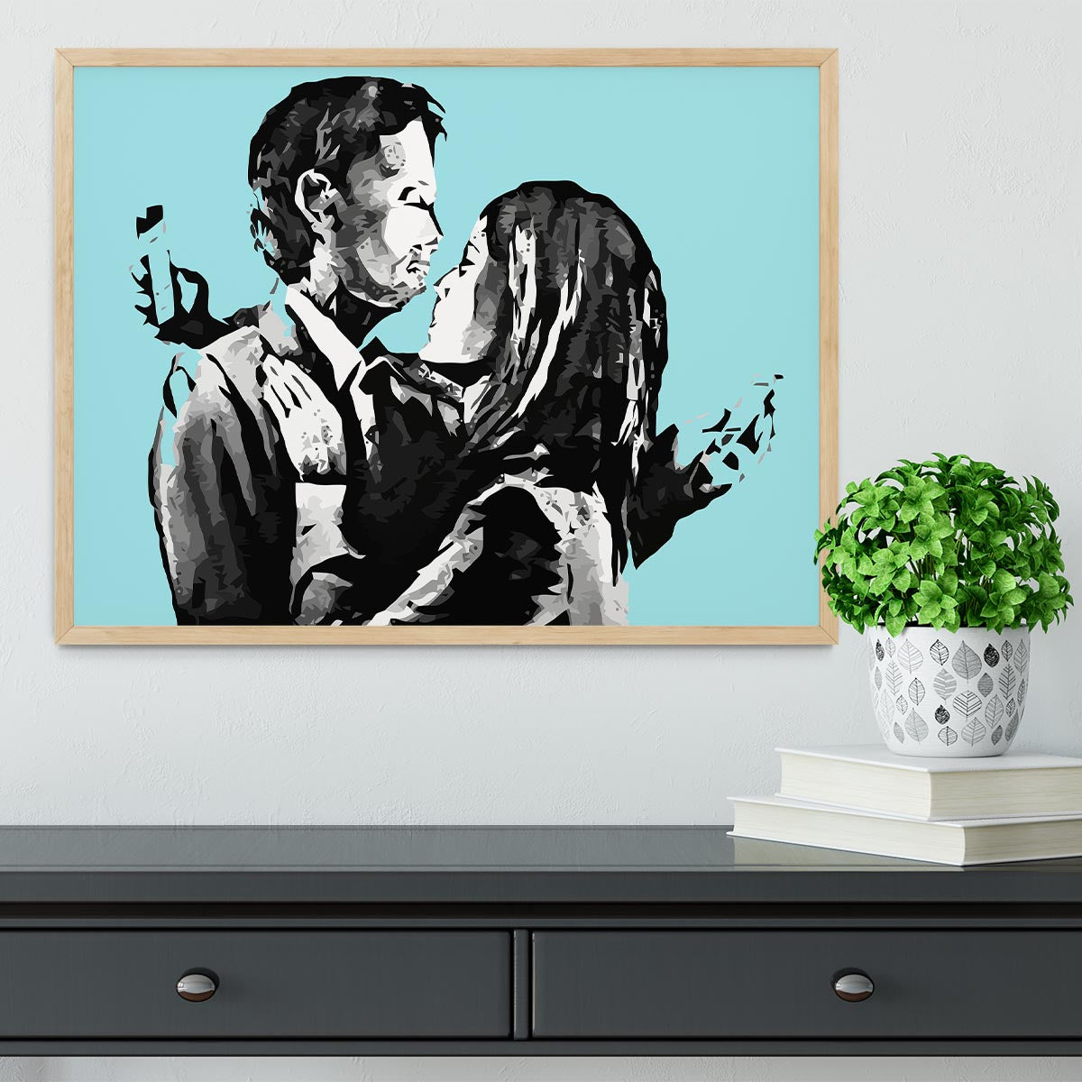 Banksy Mobile Lovers Light Blue Framed Print showcasing a couple absorbed in their mobile devices, framed elegantly.
