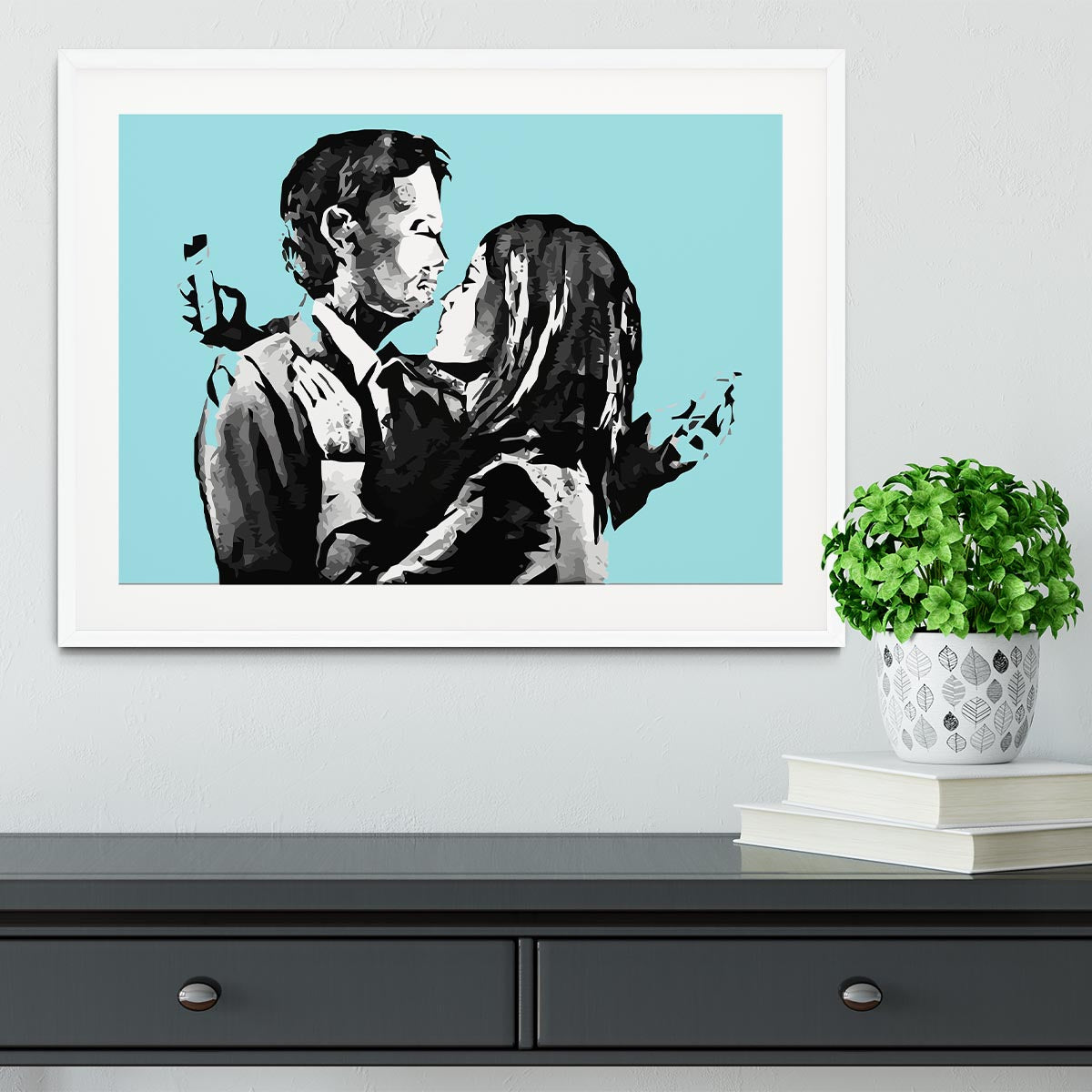 Banksy Mobile Lovers Light Blue Framed Print showcasing a couple absorbed in their mobile devices, framed elegantly.
