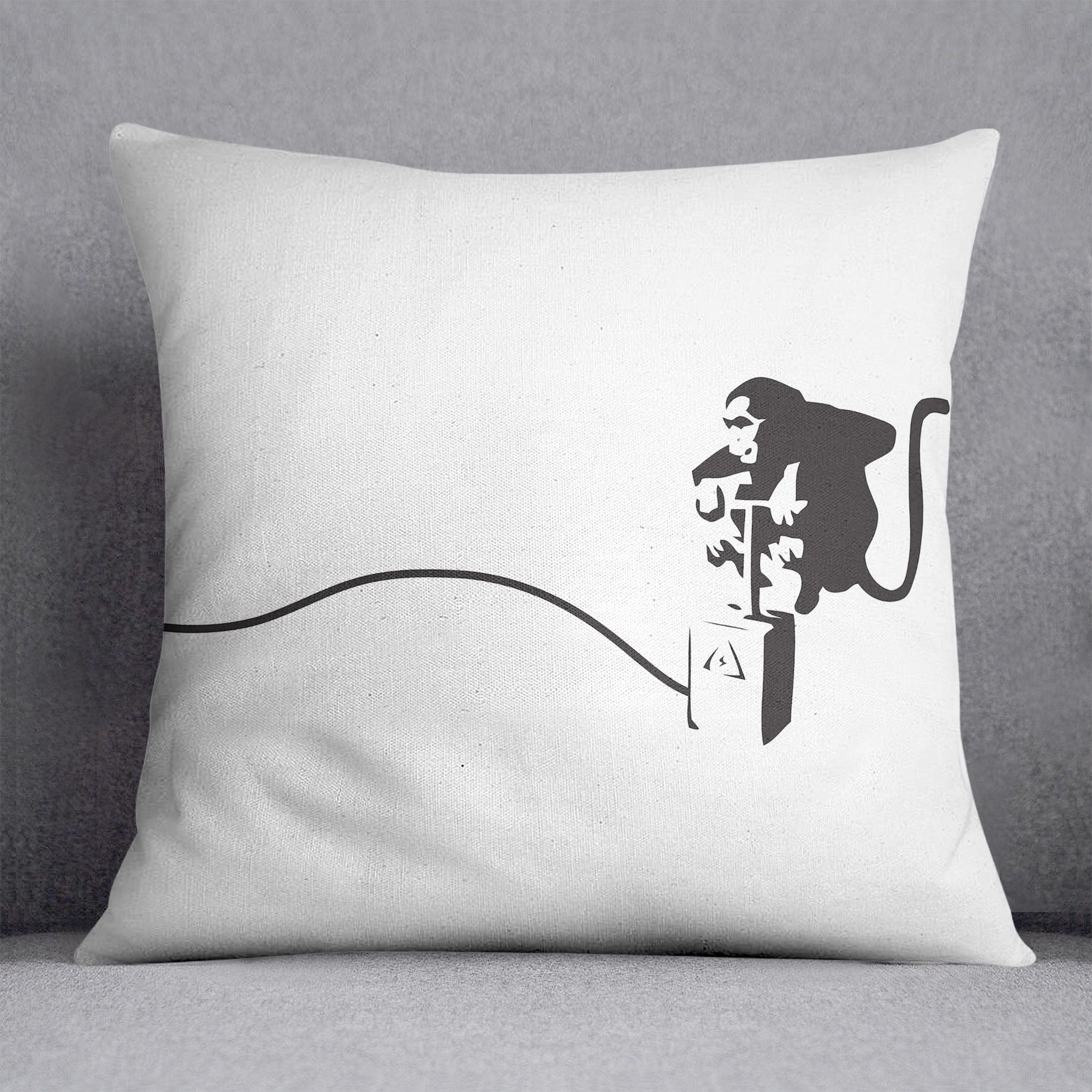 Banksy Monkey Banana Bomb Cushion featuring vibrant abstract design on luxurious vegan faux suede.