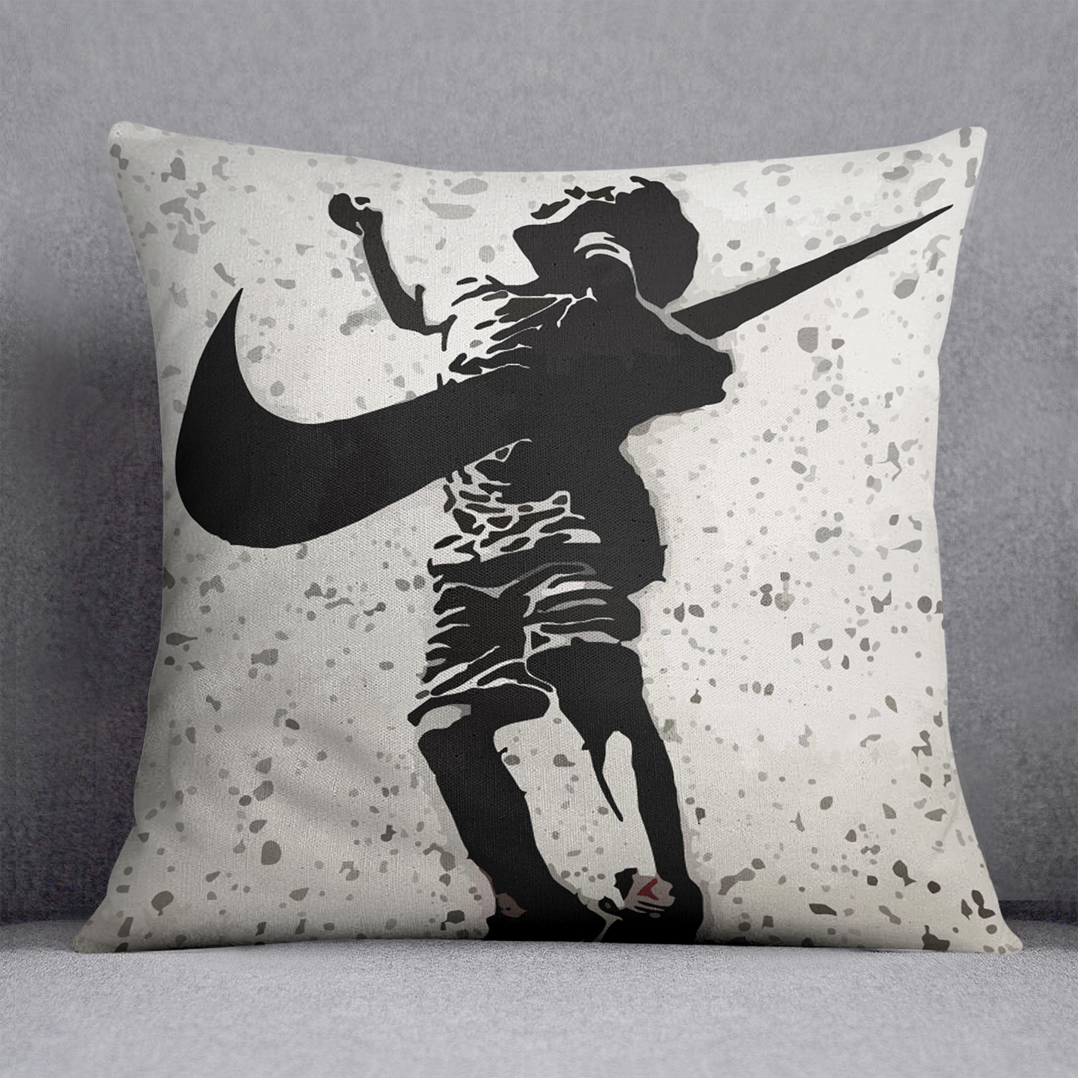 A vibrant Banksy Nike Cushion featuring colorful abstract designs on luxurious vegan faux suede, perfect for home decor.