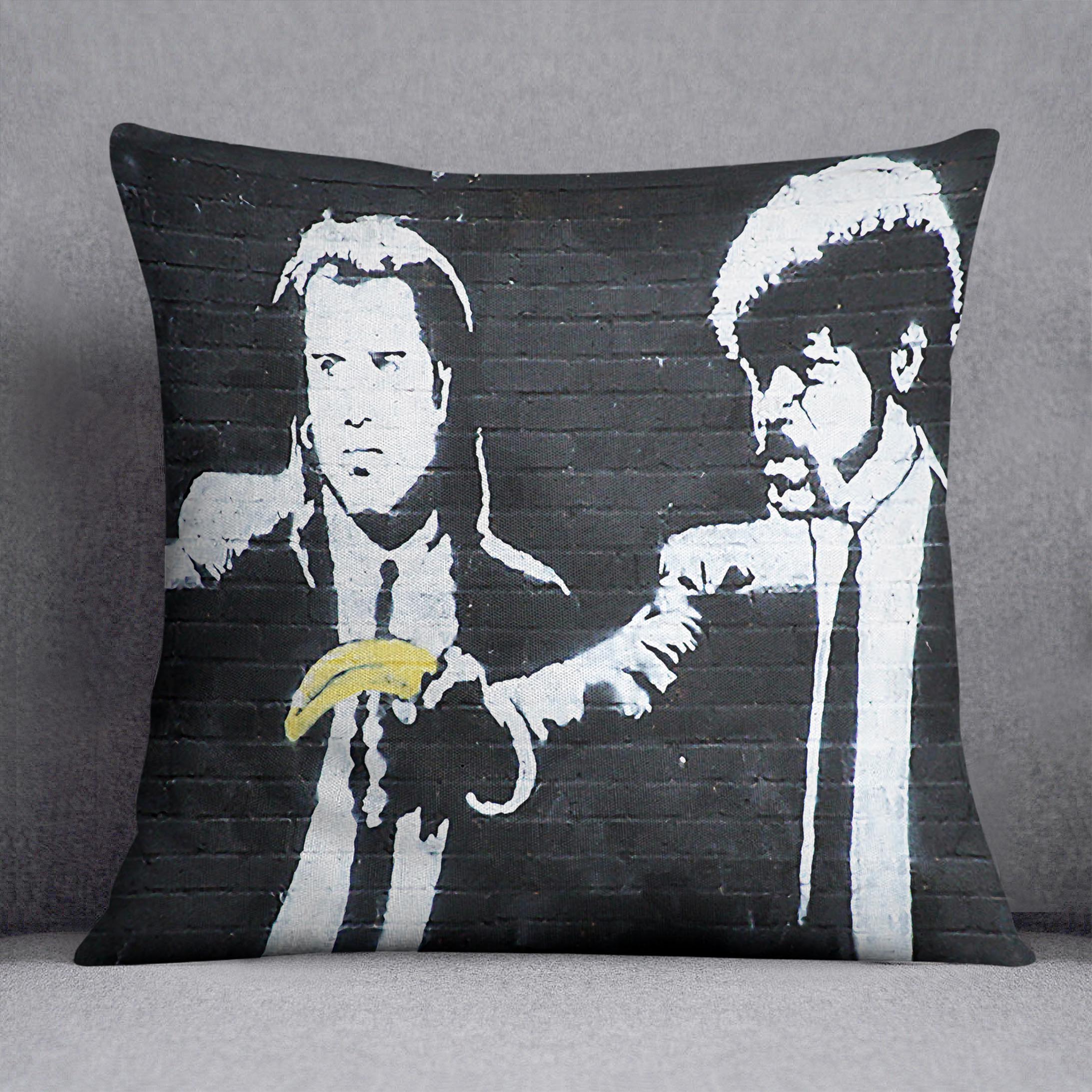 Banksy Pulp Fiction Banana Guns Cushion featuring vibrant banana gun design on luxurious vegan faux suede.