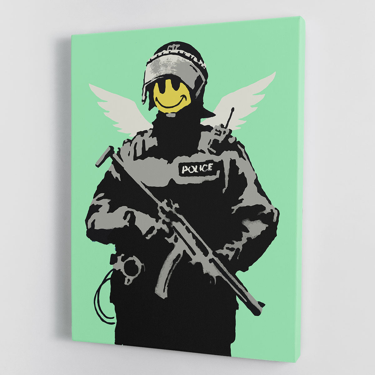 Banksy Smiley Angel Policeman canvas print featuring vibrant green colors and iconic street art style.