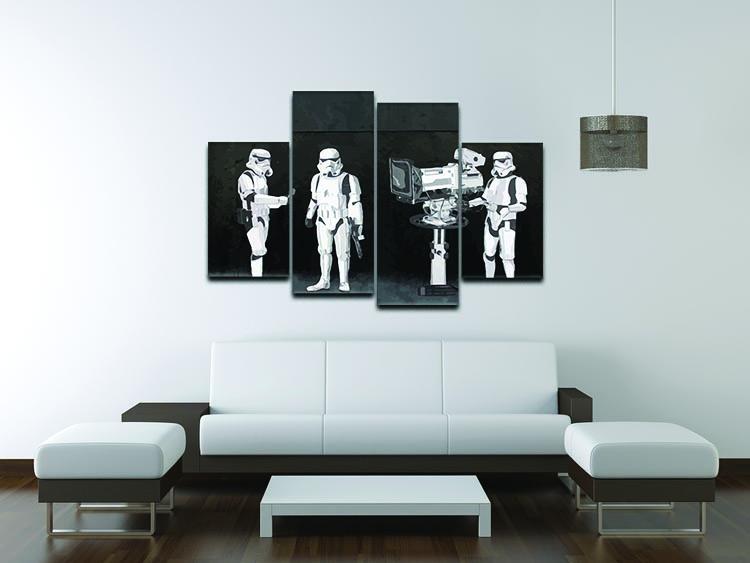 Banksy Stormtroopers Filming Oscars 4 Split Panel Canvas artwork displayed in a modern setting, showcasing four panels that create a cohesive image.