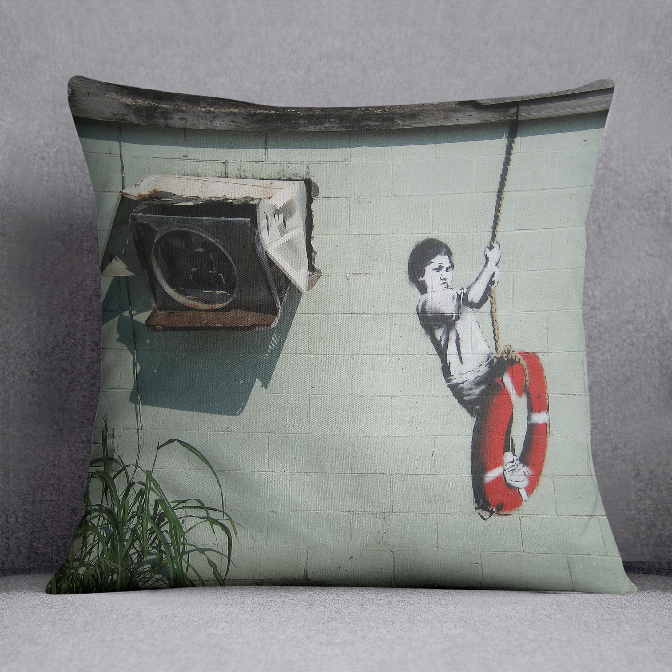 Banksy Swing Boy Cushion featuring vibrant abstract design on luxurious vegan faux suede, perfect for home decor.