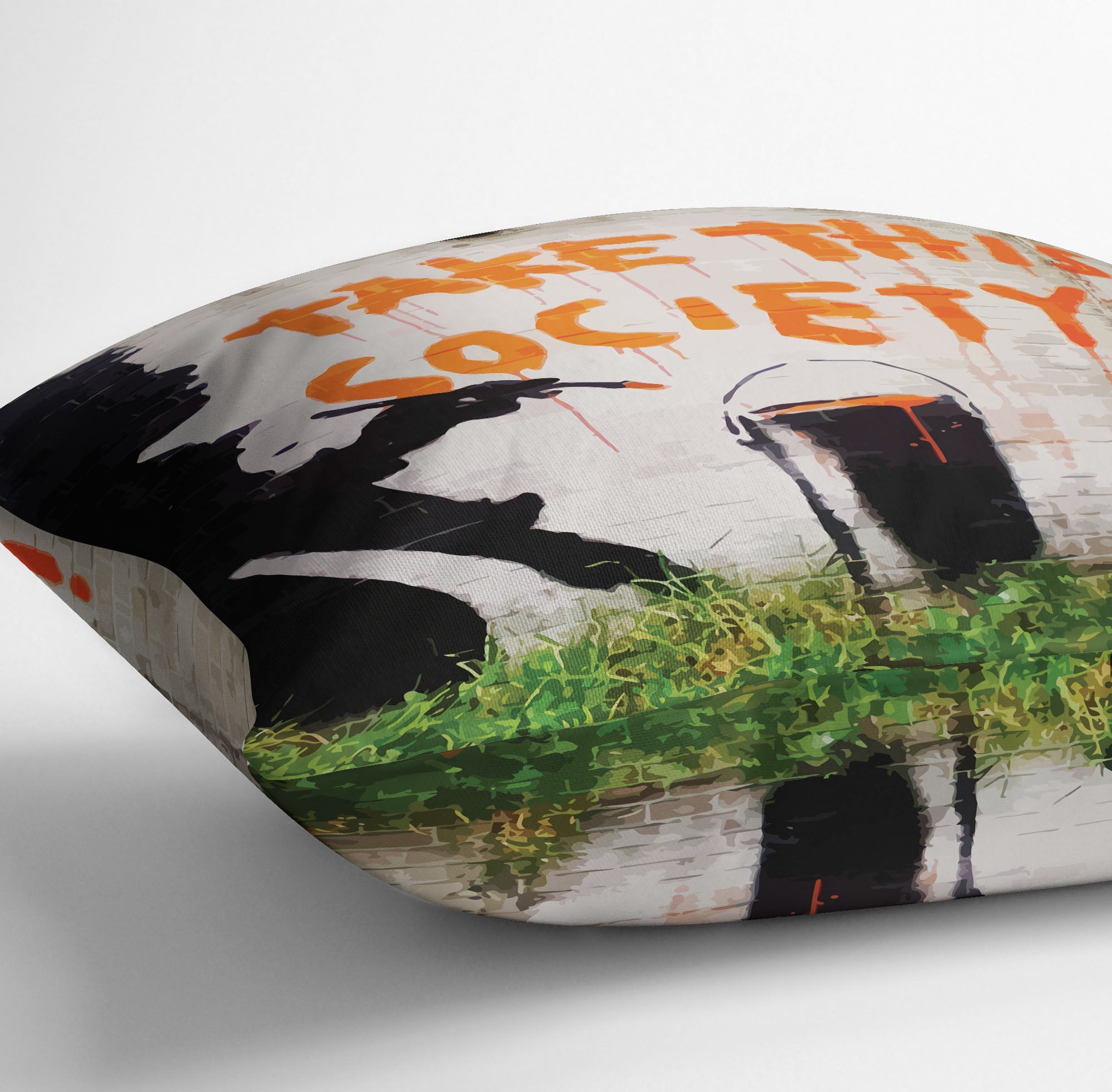 Banksy Take This Society Cushion featuring vibrant abstract design on luxurious vegan faux suede.