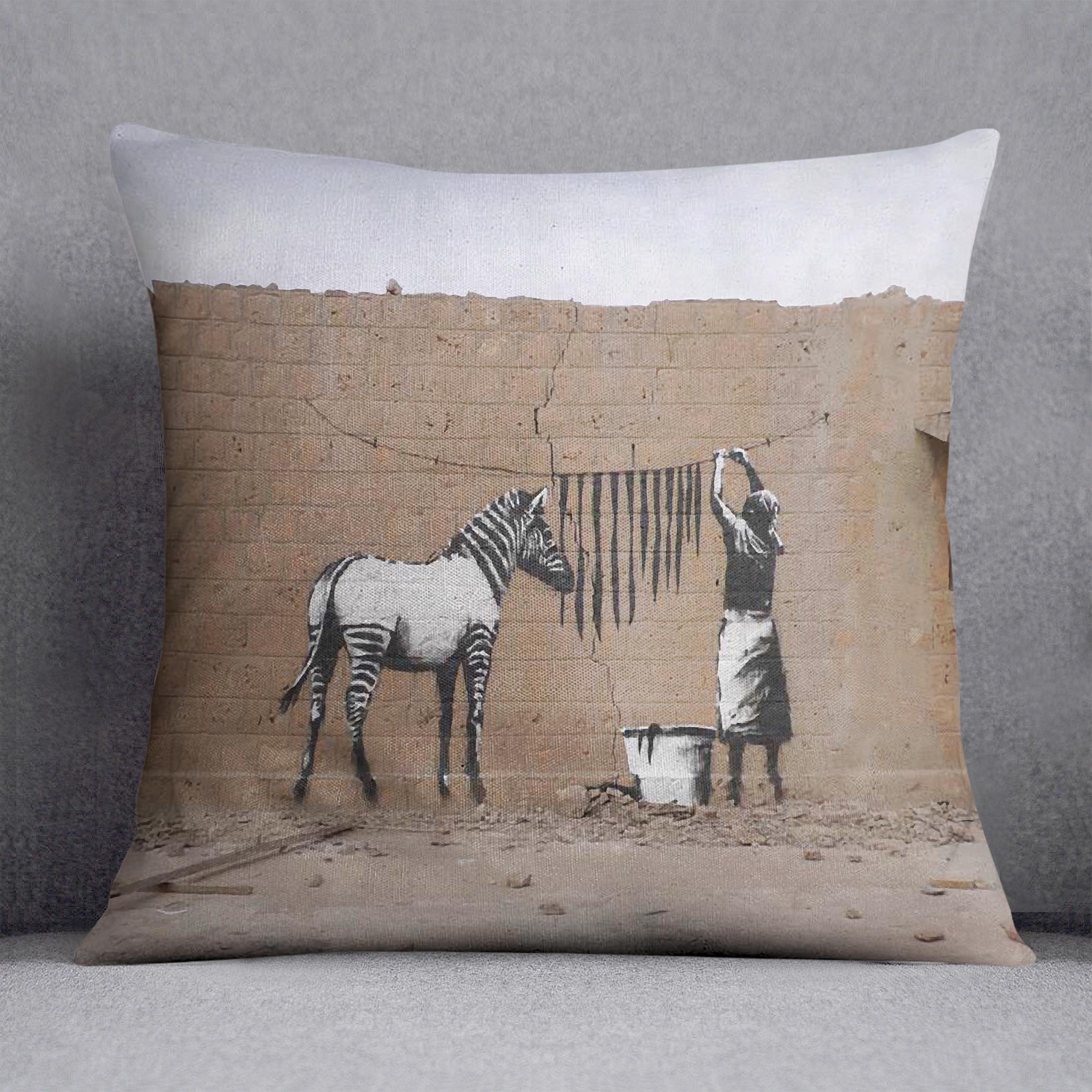 Banksy Washing Zebra Stripes Cushion featuring vibrant abstract design on luxurious vegan faux suede fabric.