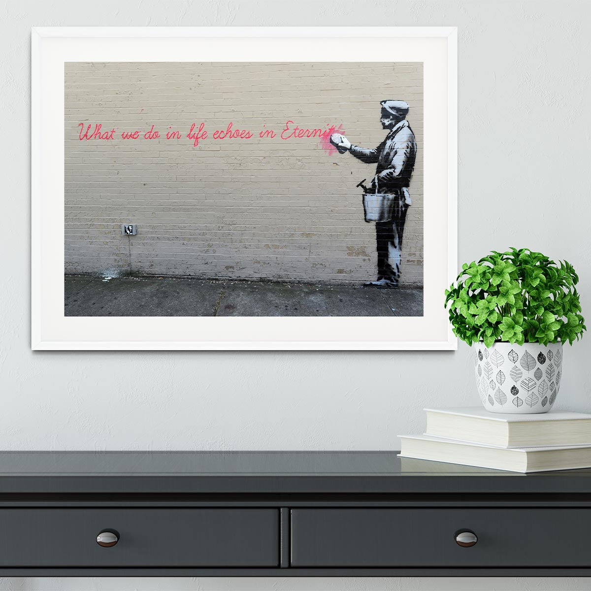 Banksy What We Do In Life Framed Print in a stylish black frame, showcasing vibrant colors and intricate details.
