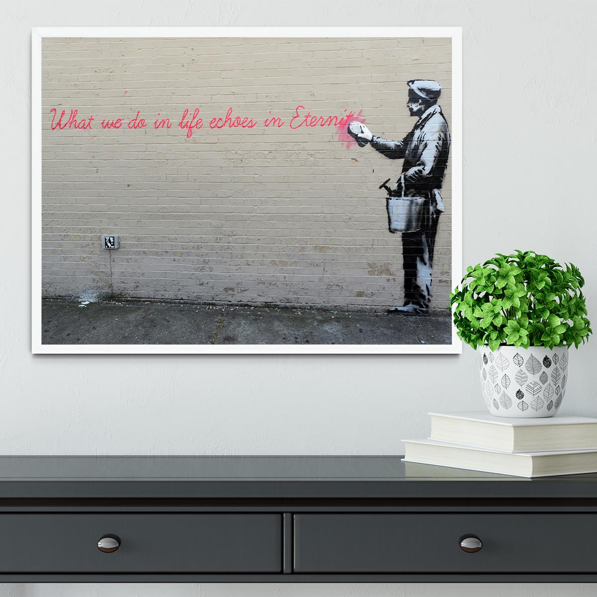 Banksy What We Do In Life Framed Print in a stylish black frame, showcasing vibrant colors and intricate details.