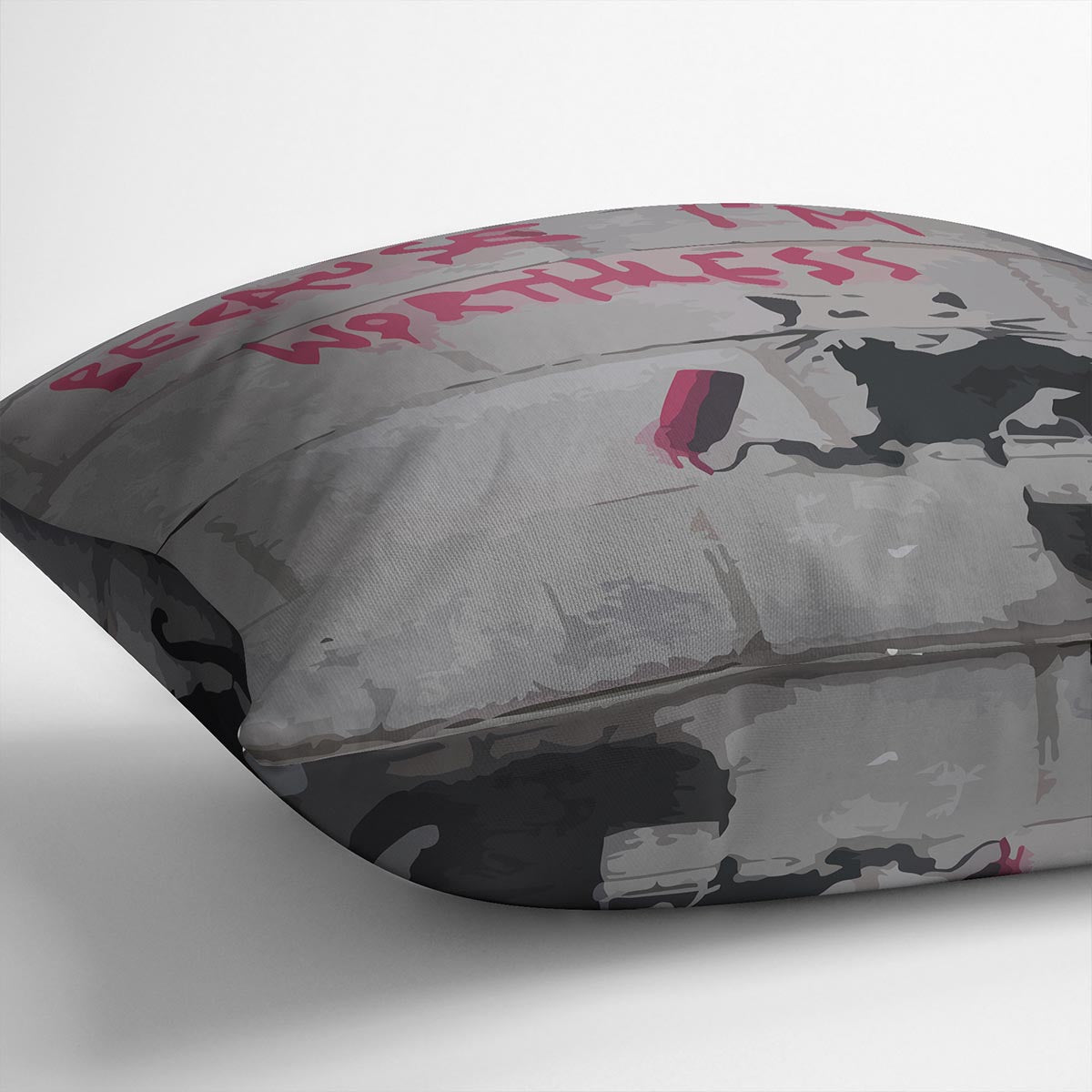 Banksy Worthless Rat Cushion featuring vibrant abstract design on luxurious vegan faux suede.