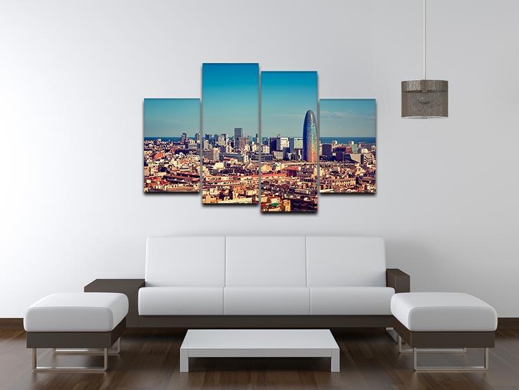 A vibrant 4-split canvas artwork depicting the Barcelona skyline with skyscrapers, showcasing a dynamic and modern design.