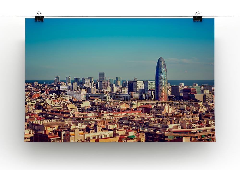 A beautiful canvas print of the Barcelona skyline featuring modern skyscrapers against a vibrant sky.