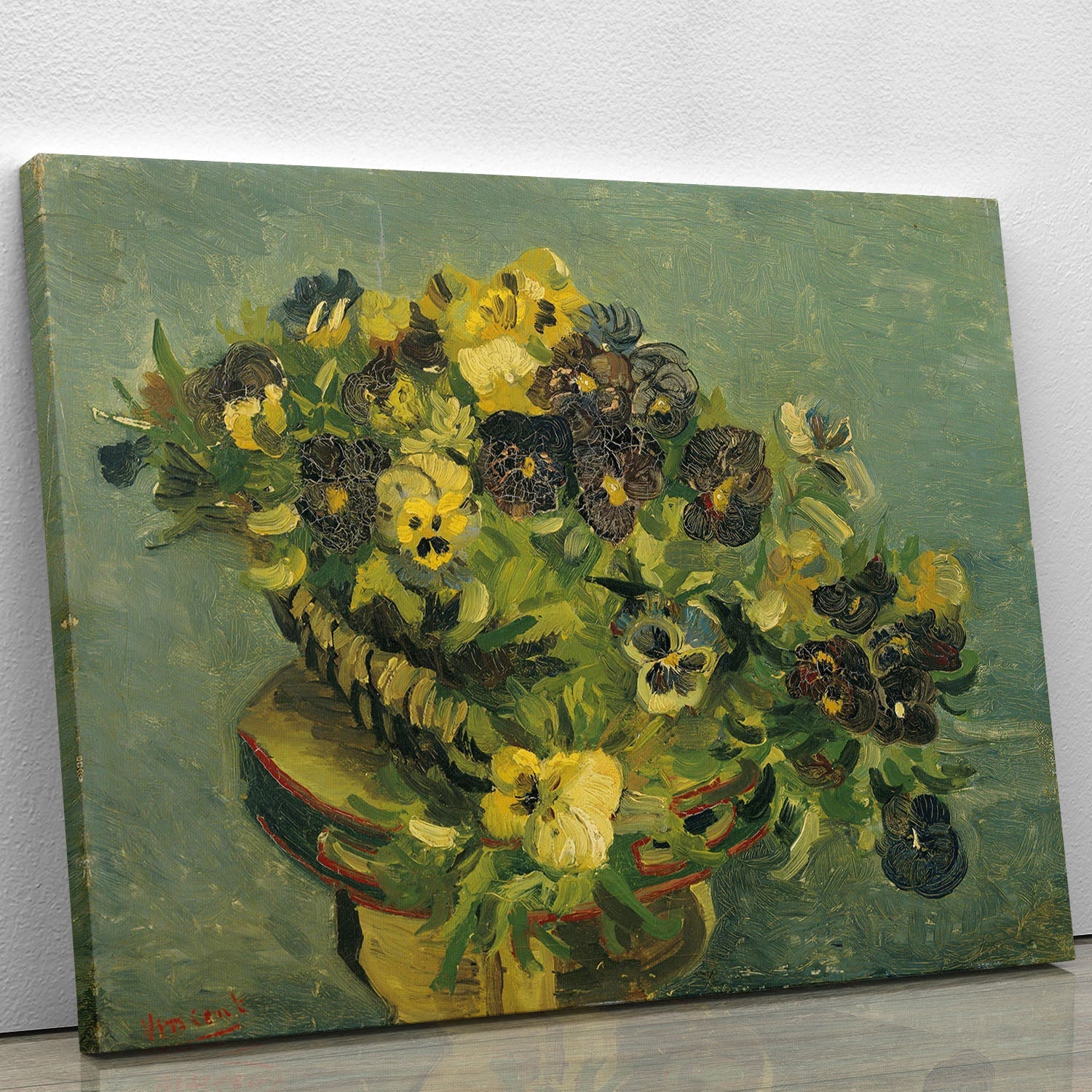 A vibrant canvas print of Van Gogh's Basket of Pansies, showcasing colorful flowers in a basket on a small table.