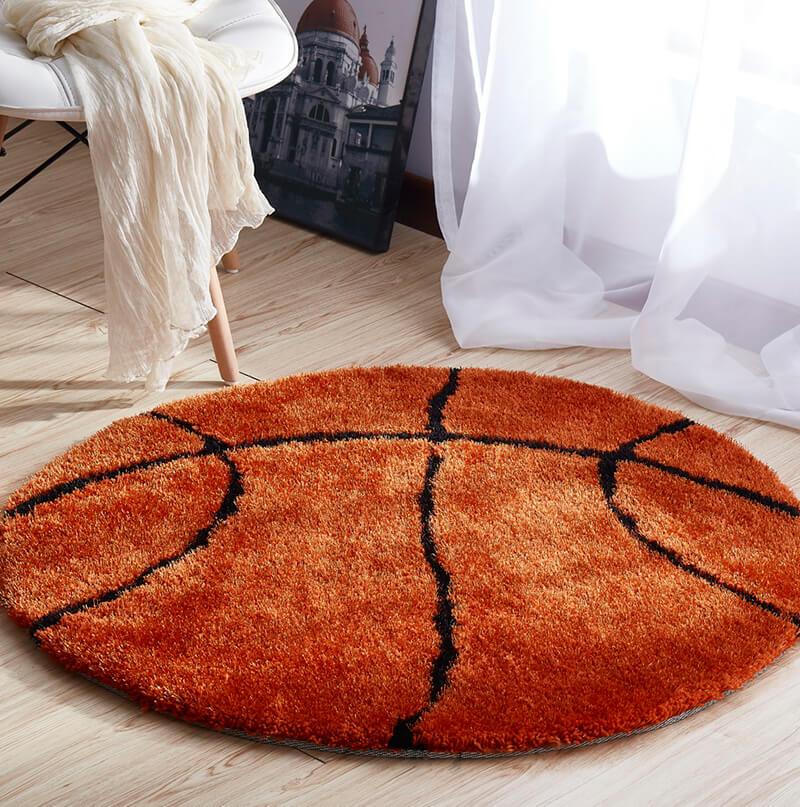 Basketball shape decorative area rug in brown and black, featuring a soft shaggy texture, perfect for kids' rooms.