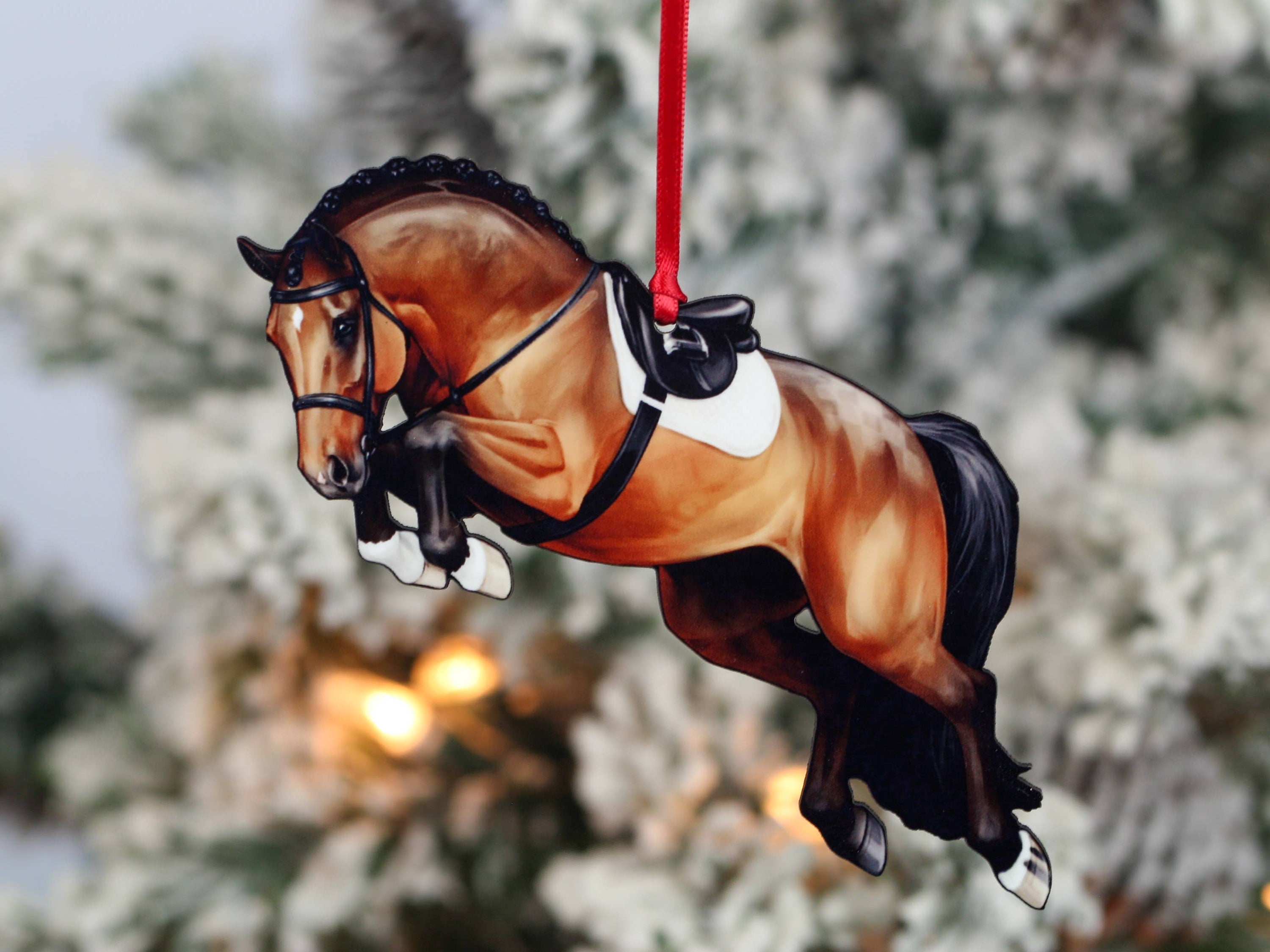 A beautifully crafted jumping horse ornament in bay color, made of composite wood, featuring a braided mane, perfect for Christmas decoration.