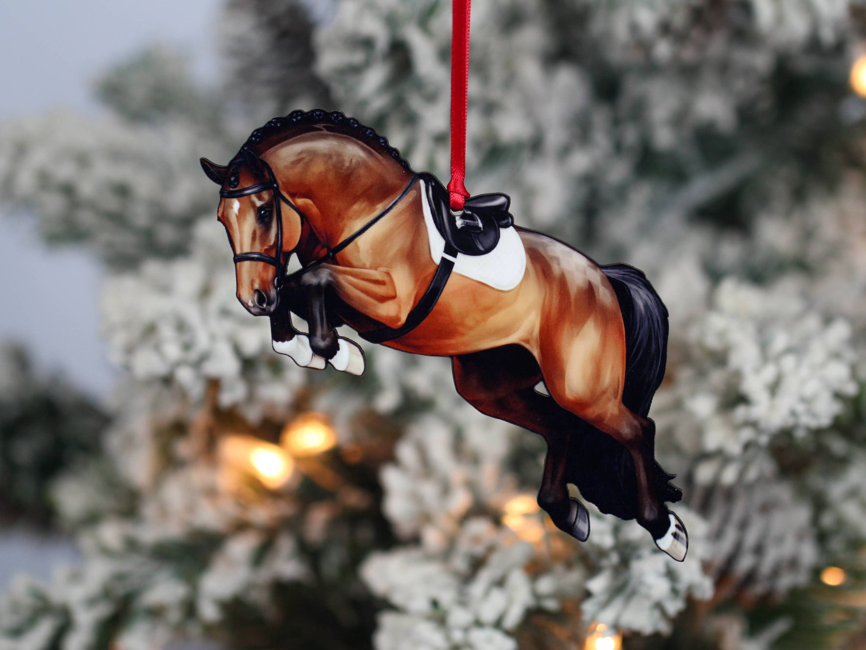 A beautifully crafted jumping horse ornament in bay color, made of composite wood, featuring a braided mane, perfect for Christmas decoration.