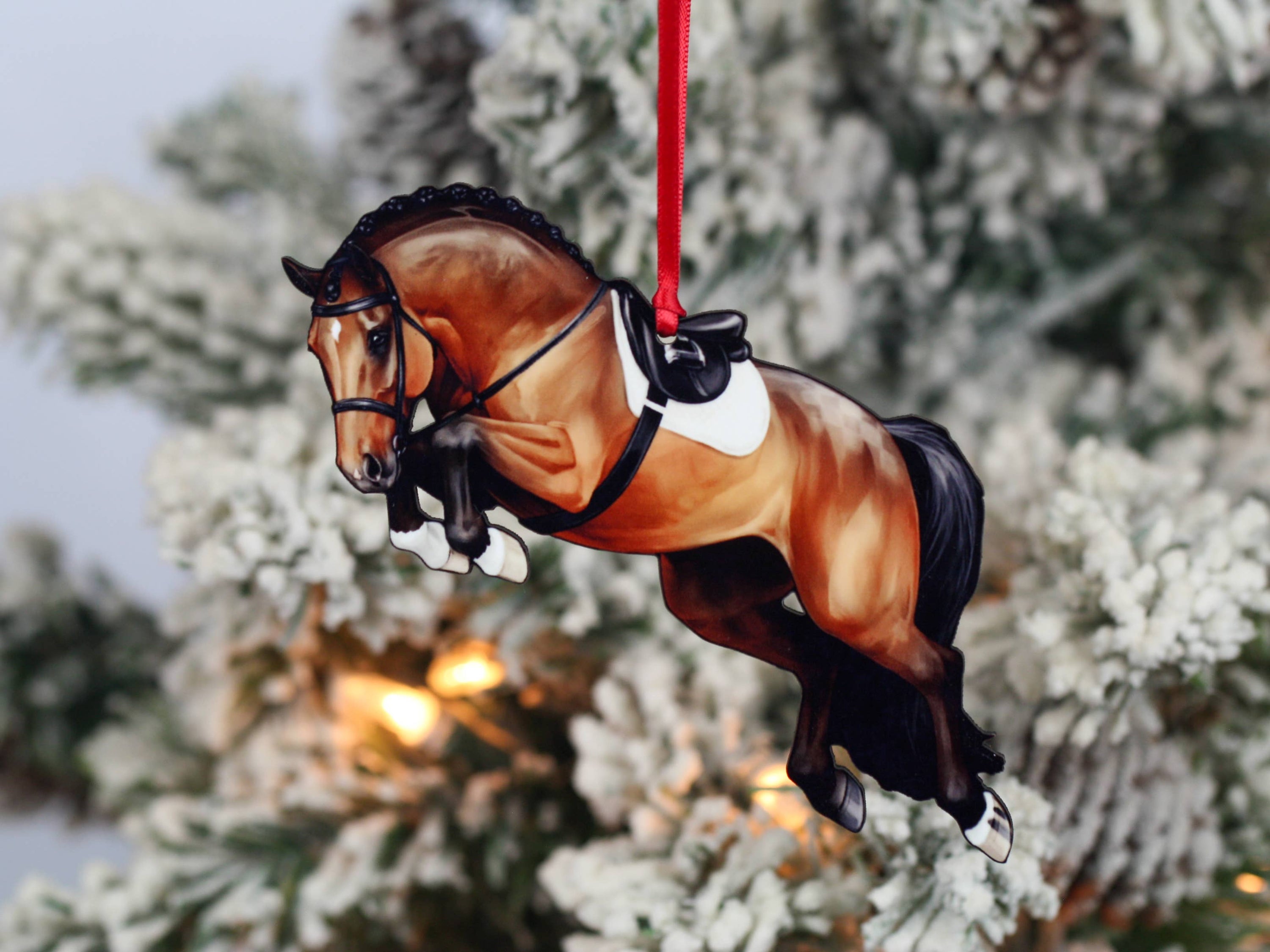 A beautifully crafted jumping horse ornament in bay color, made of composite wood, featuring a braided mane, perfect for Christmas decoration.