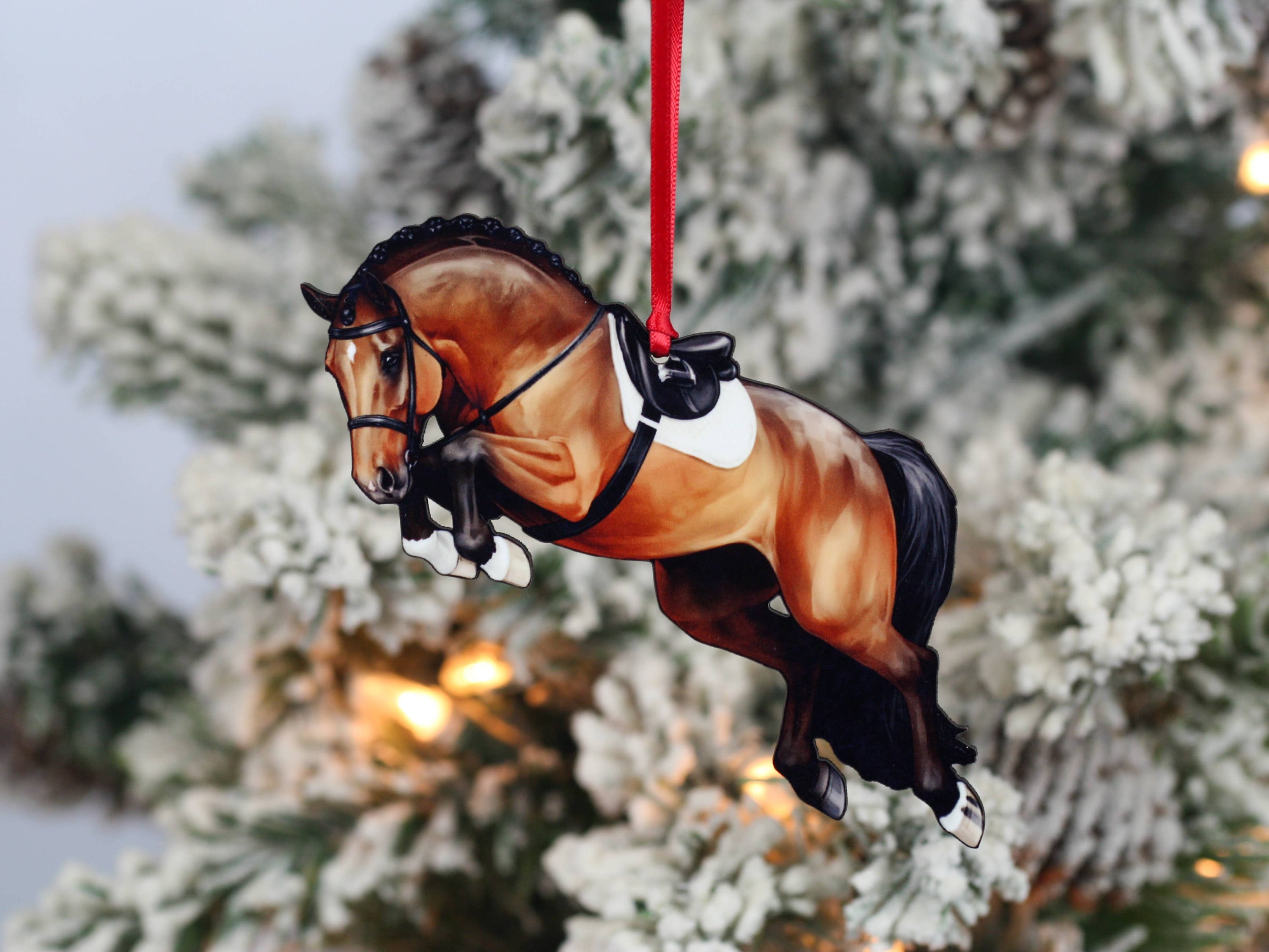 A beautifully crafted jumping horse ornament in bay color, made of composite wood, featuring a braided mane, perfect for Christmas decoration.