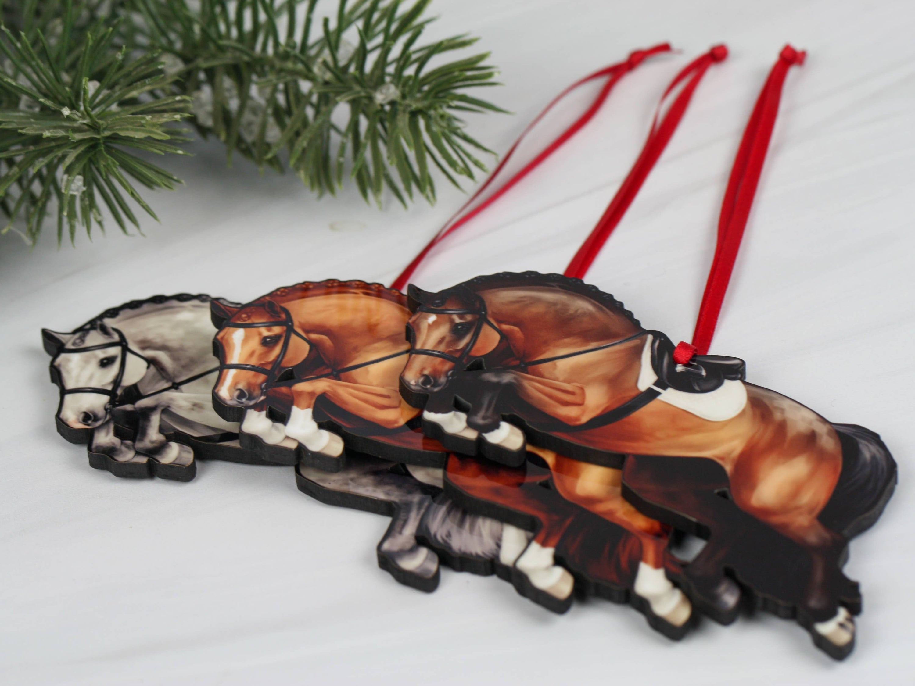 A beautifully crafted jumping horse ornament in bay color, made of composite wood, featuring a braided mane, perfect for Christmas decoration.