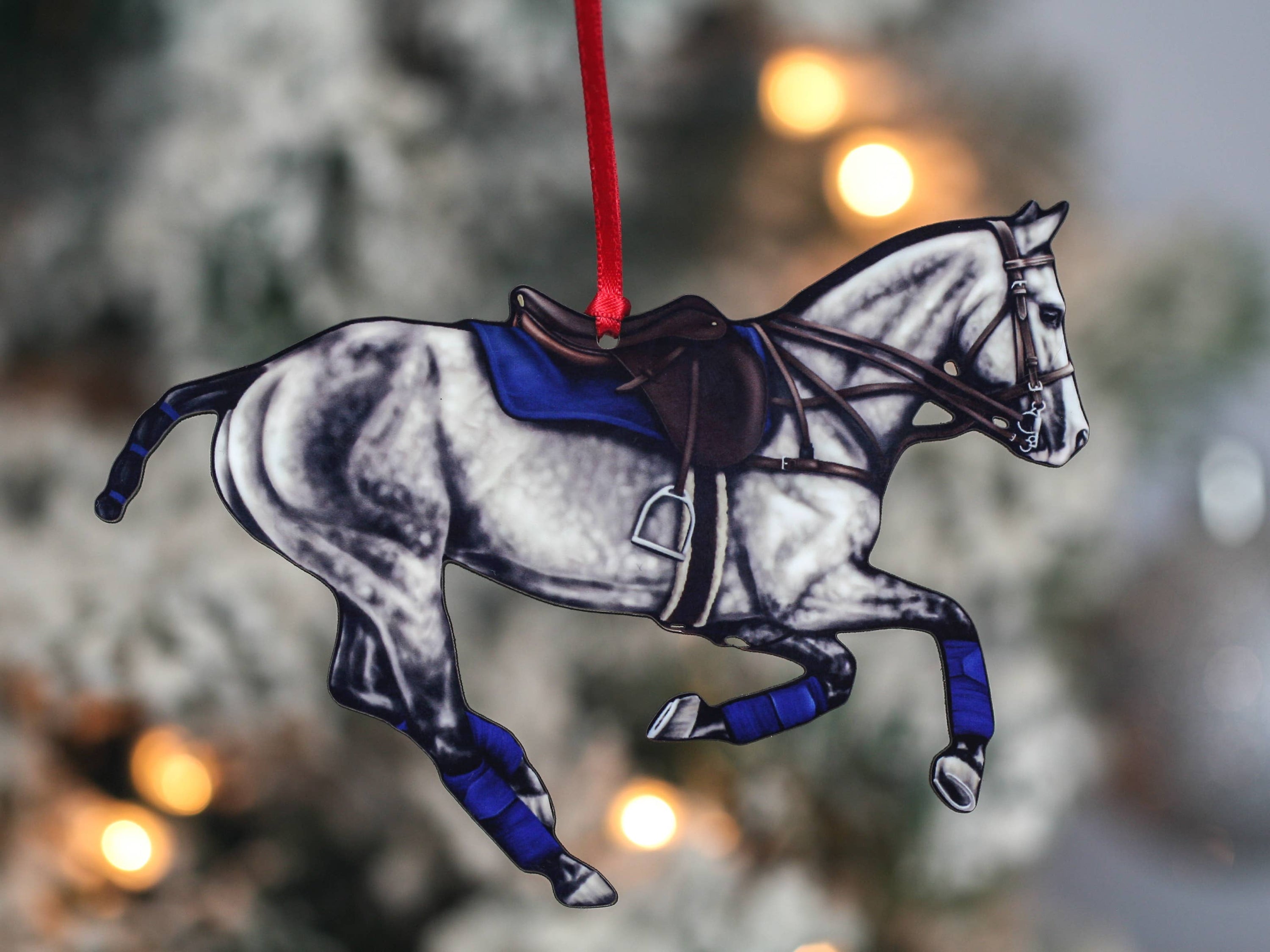Handmade Bay Polo Pony Ornament with red and black ribbons, showcasing a galloping polo horse design.
