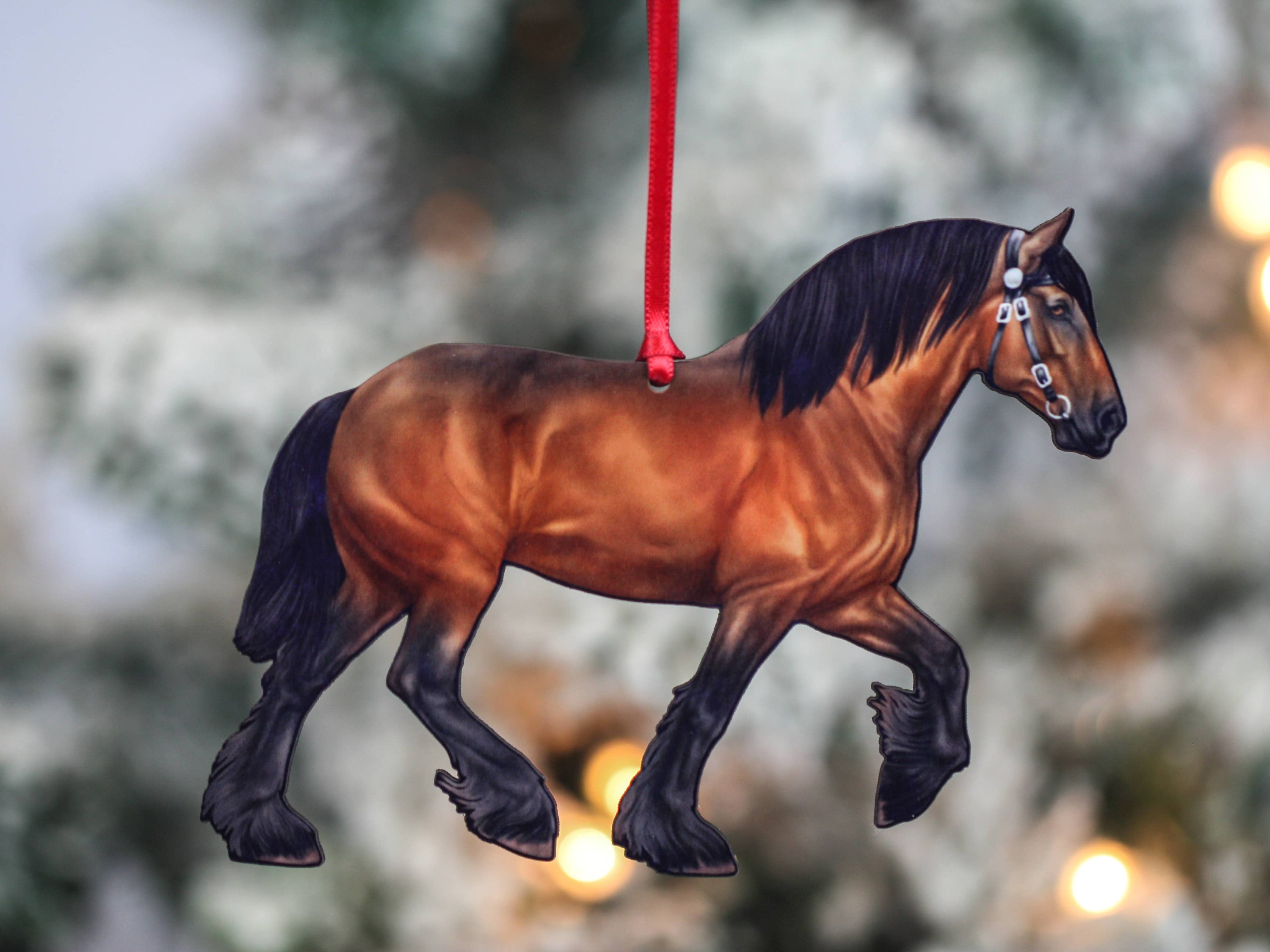 A beautifully crafted Bay Shire Draft Horse Ornament made from composite wood, featuring a glossy front and dark brown back, adorned with red and black ribbons.