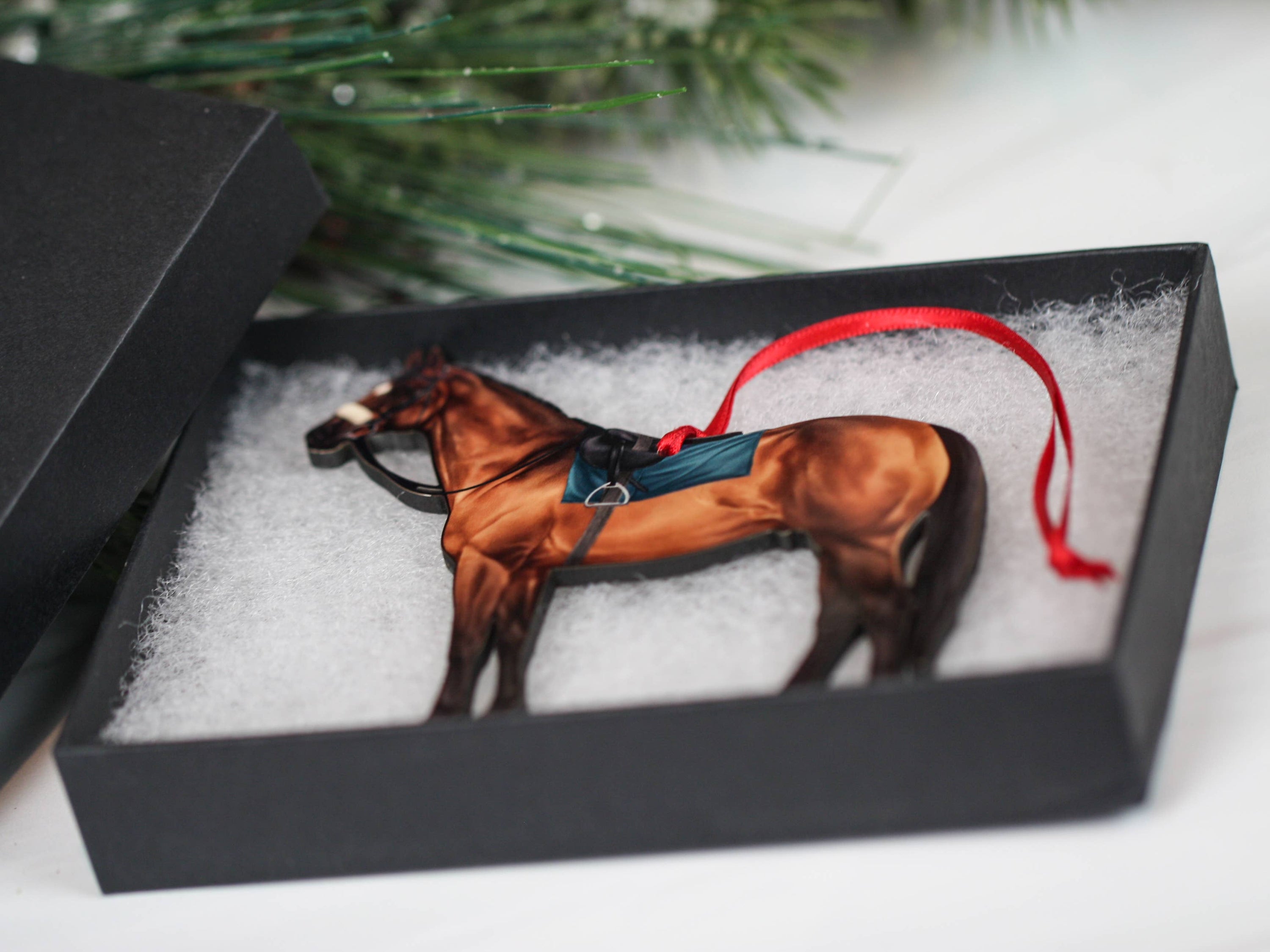 A beautifully crafted bay Thoroughbred Race Horse ornament made from composite wood, featuring glossy artwork and a dark brown back.