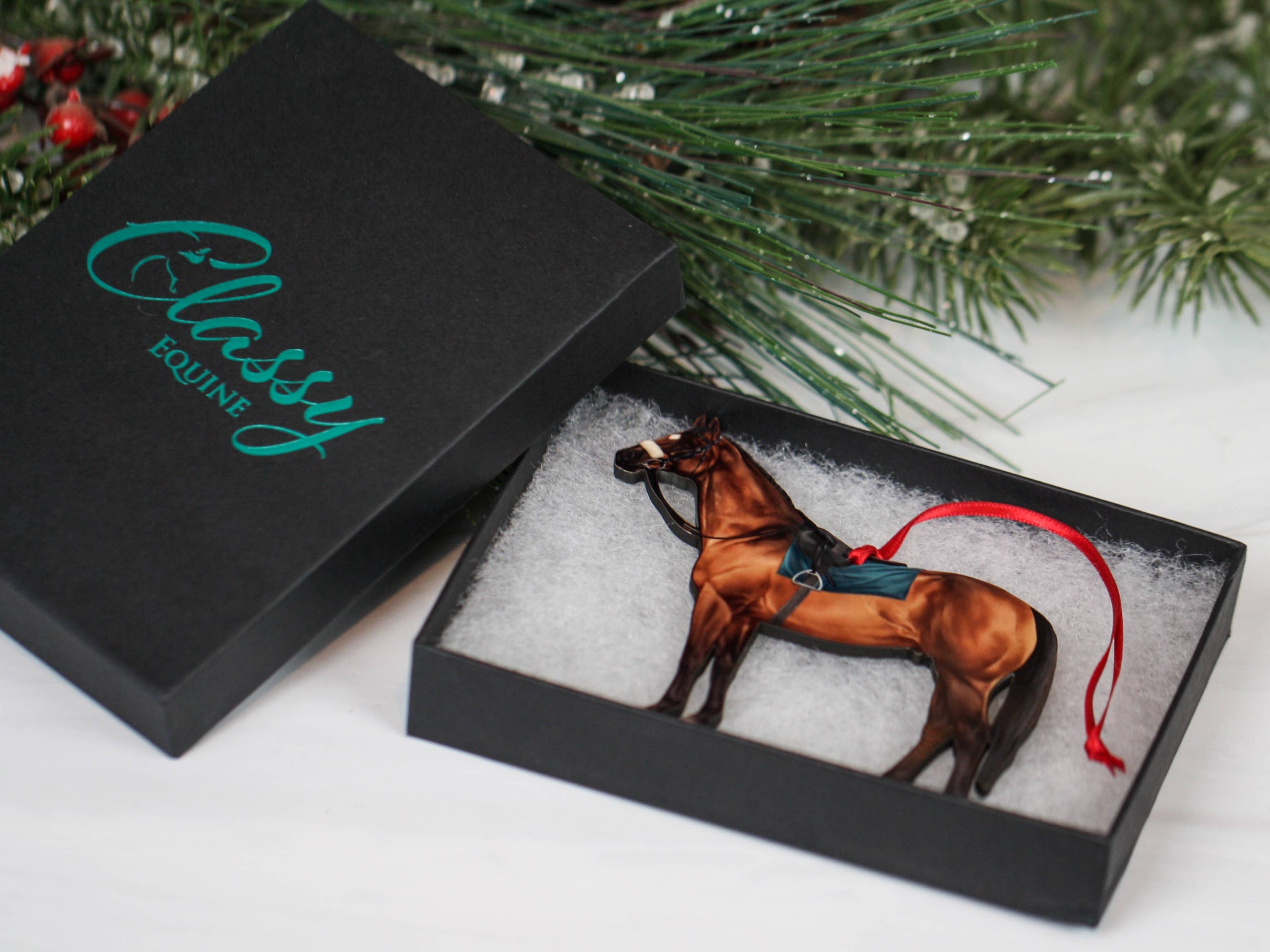 A beautifully crafted bay Thoroughbred Race Horse ornament made from composite wood, featuring glossy artwork and a dark brown back.