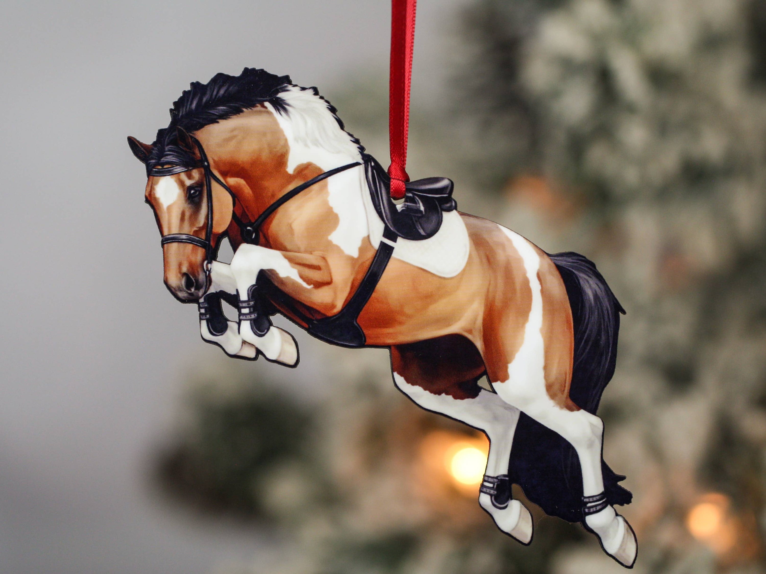 Handcrafted bay tobiano jumper ornament made from composite wood, featuring a glossy front and dark brown back, perfect for holiday decor.
