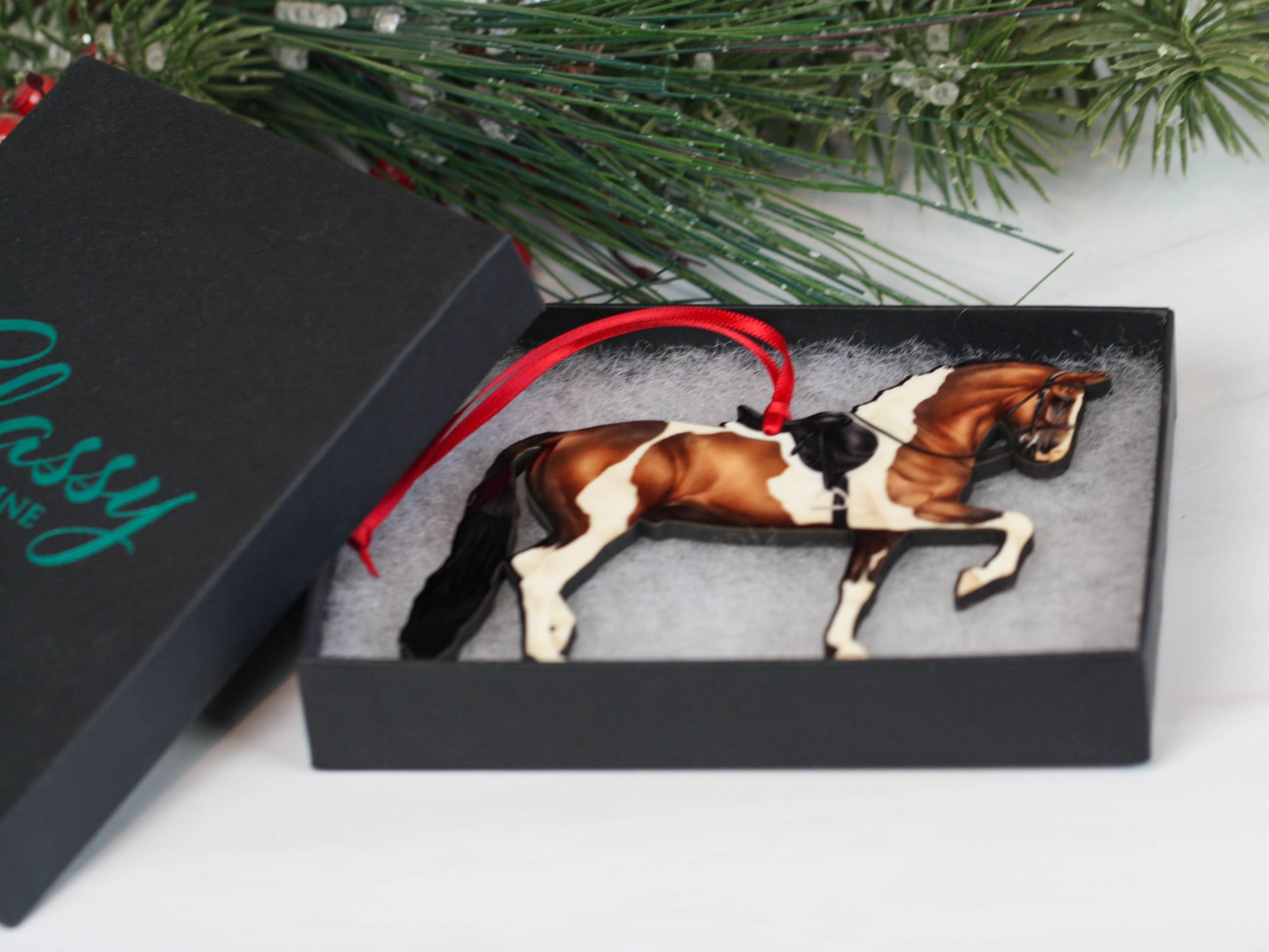 Bay Tobiano Morgan Horse Ornament, handmade from composite wood, featuring intricate laser-cut details and glossy finish, perfect for Christmas decoration.