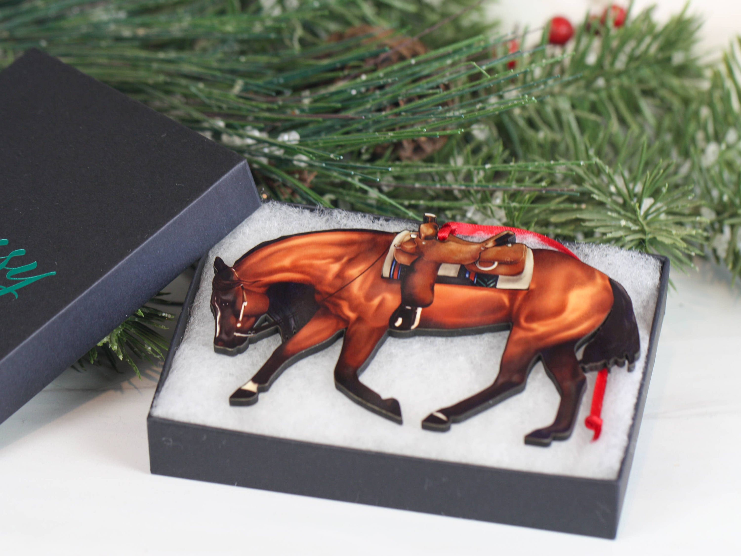 Bay Western Riding Christmas Ornament featuring a Quarter Horse, handmade from composite wood with red and black ribbons.