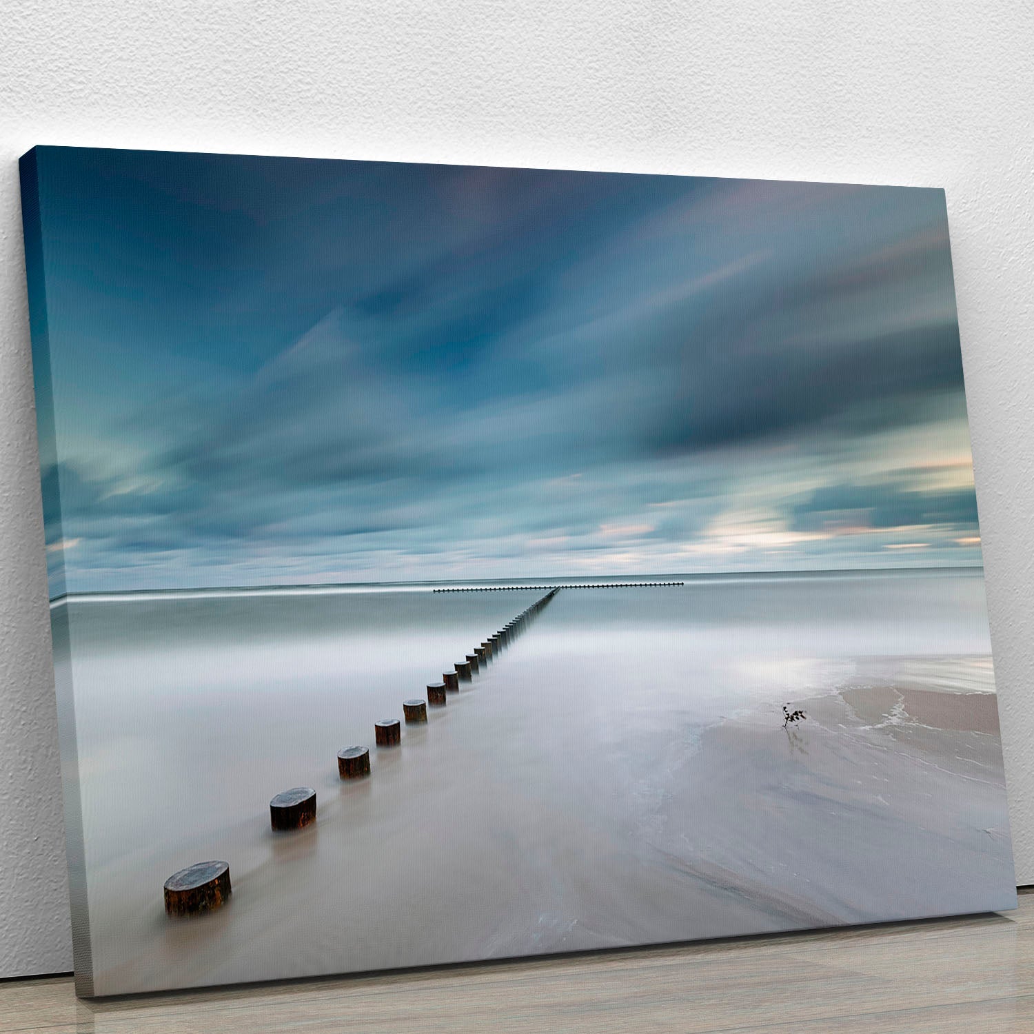 A beautiful canvas print featuring a serene beach scene under a vibrant sky, perfect for home decor.
