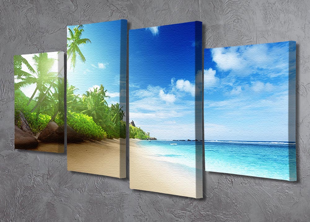 A stunning 4 split panel canvas artwork depicting a beach at sunset on Mahe Island, showcasing vibrant colors and serene scenery.