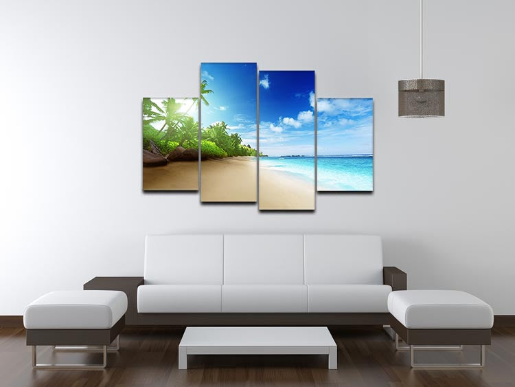 A stunning 4 split panel canvas artwork depicting a beach at sunset on Mahe Island, showcasing vibrant colors and serene scenery.