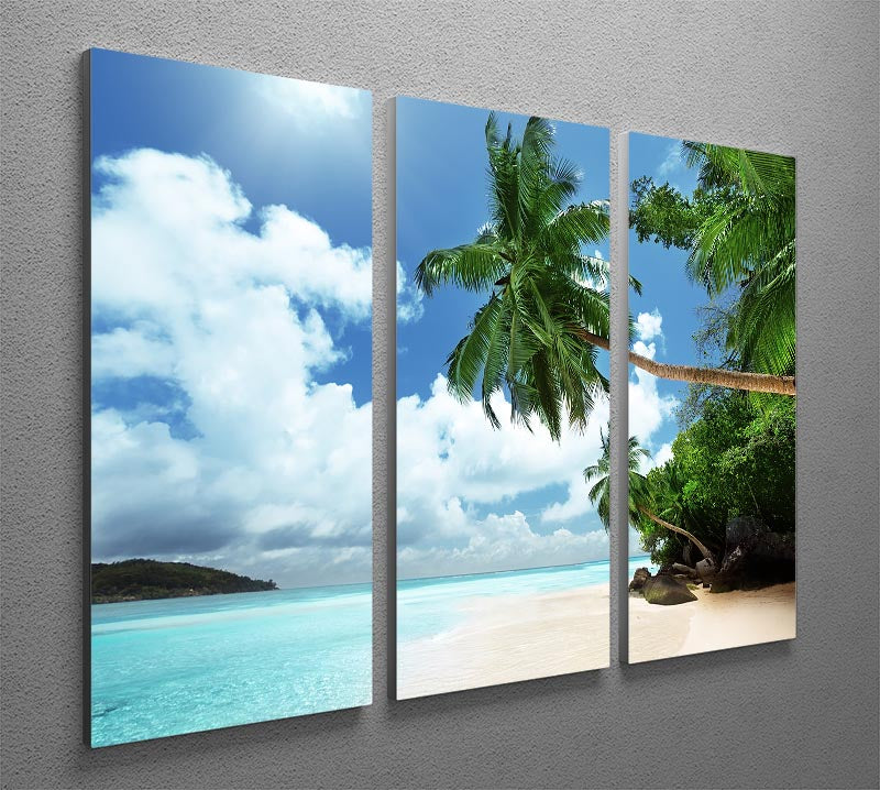 A beautiful 3-panel canvas print depicting a serene beach on Mahe island, showcasing vibrant colors and a tranquil atmosphere.