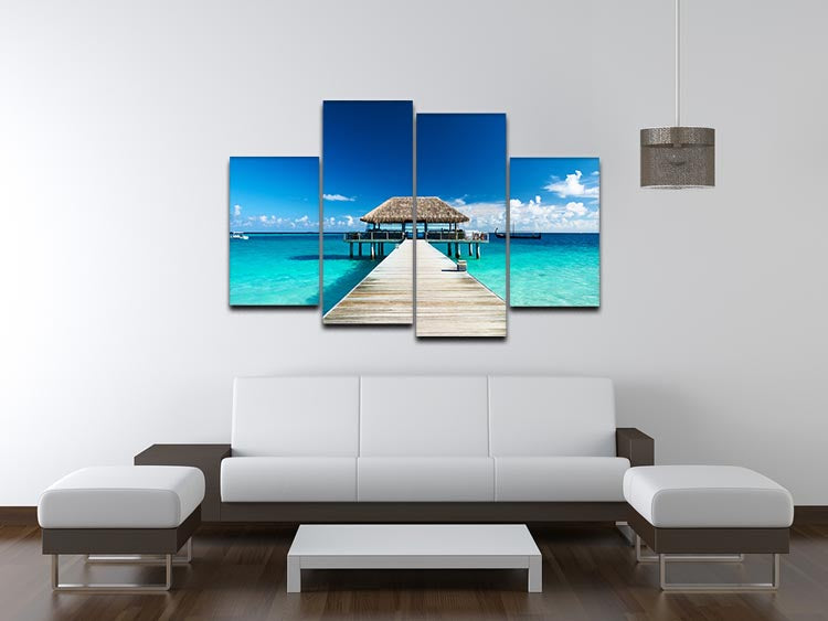 A beautiful 4 split panel canvas depicting a Maldives beach with a jetty, showcasing vibrant colors and serene scenery.