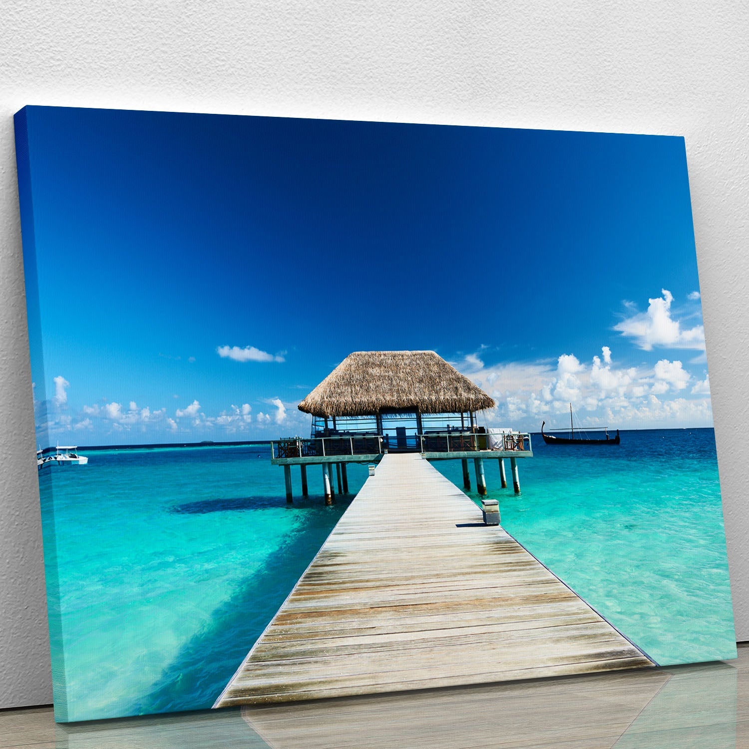 A beautiful canvas print of a Maldives beach with a jetty, showcasing vibrant colors and serene ocean views.