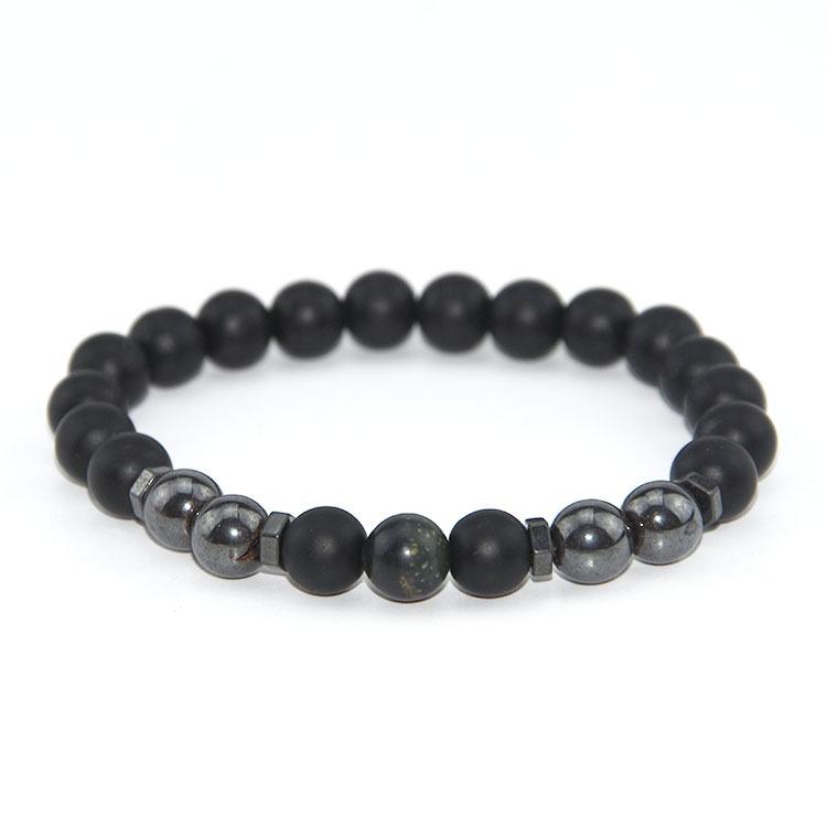Elegant beaded bracelet featuring black magnet design with garnet stones, suitable for both men and women.