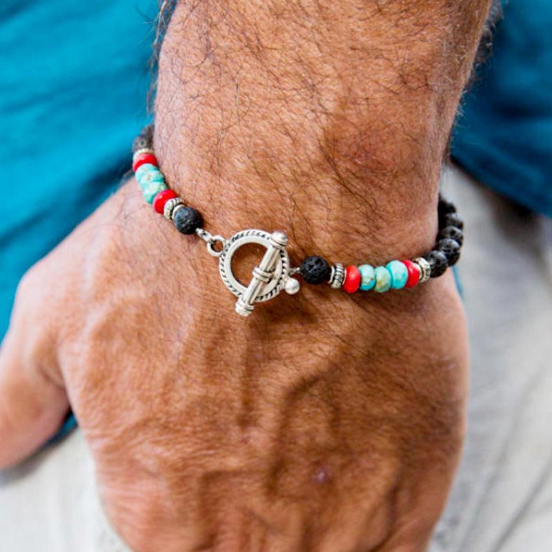 Beaded New Volcanic Stone Men's Bracelet featuring turquoise beads and elastic design, showcasing its unique style and craftsmanship.