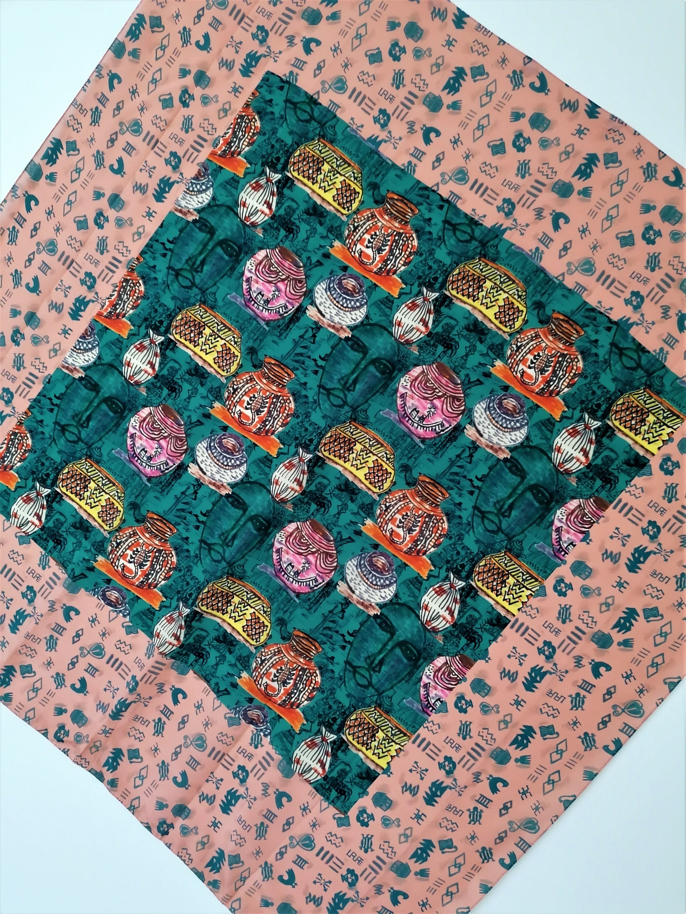 Beautiful Nostalgia Crepe de Chine Scarf featuring clay pots and Adinkra symbols, showcasing vibrant colors and luxurious fabric.