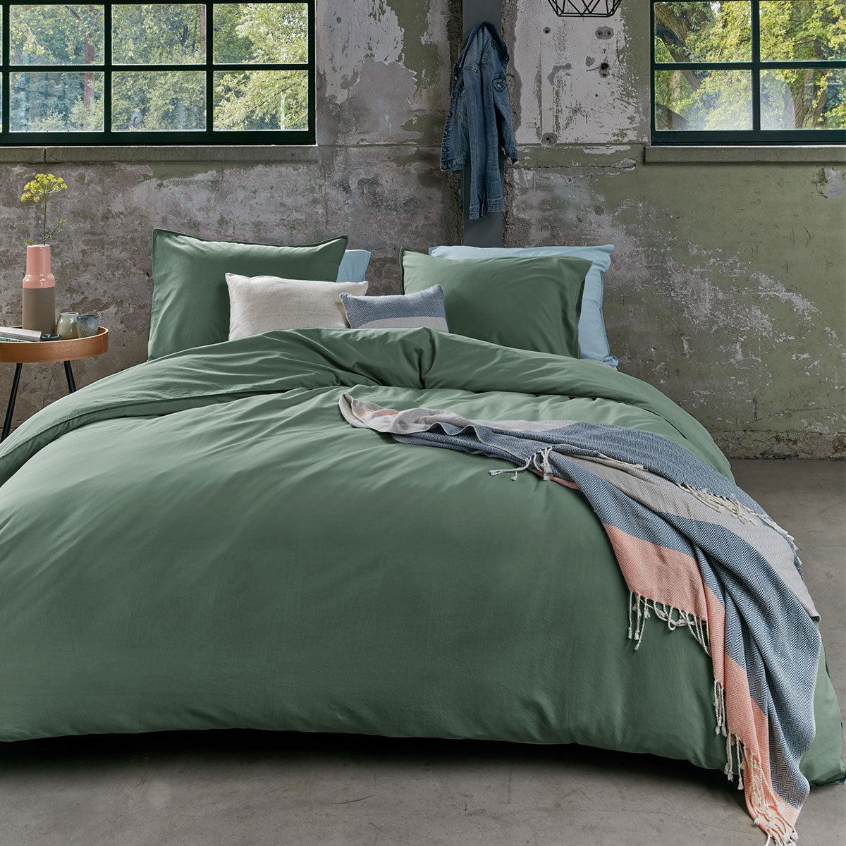 Bedding House Organic Cotton Basic Green Quilt Cover Set King displayed on a bed, showcasing its solid green color and soft texture.